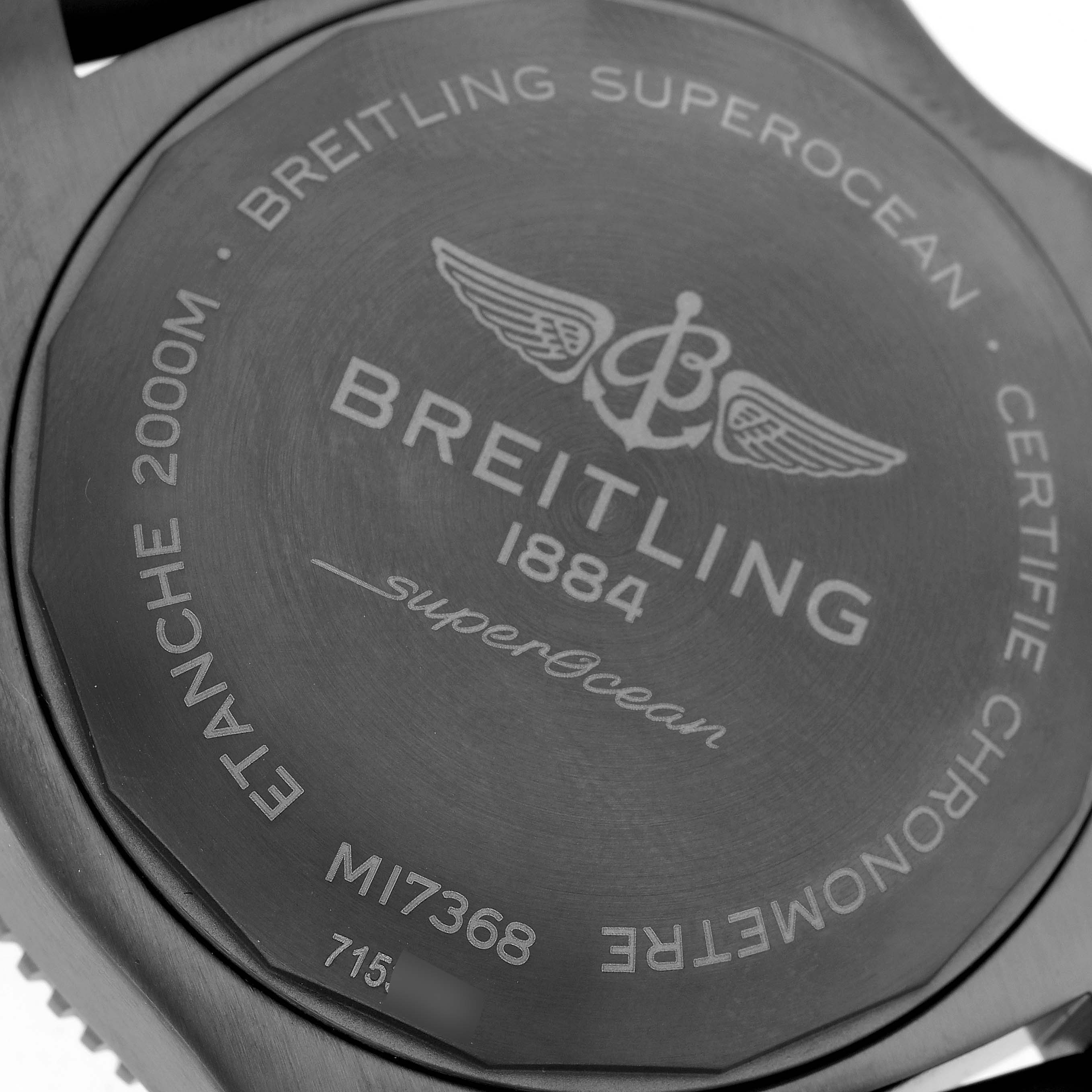 The image shows the back case of a Breitling Superocean M17368 Men's Stainless Steel Yellow Dial watch, highlighting the brand, model, and depth rating.
