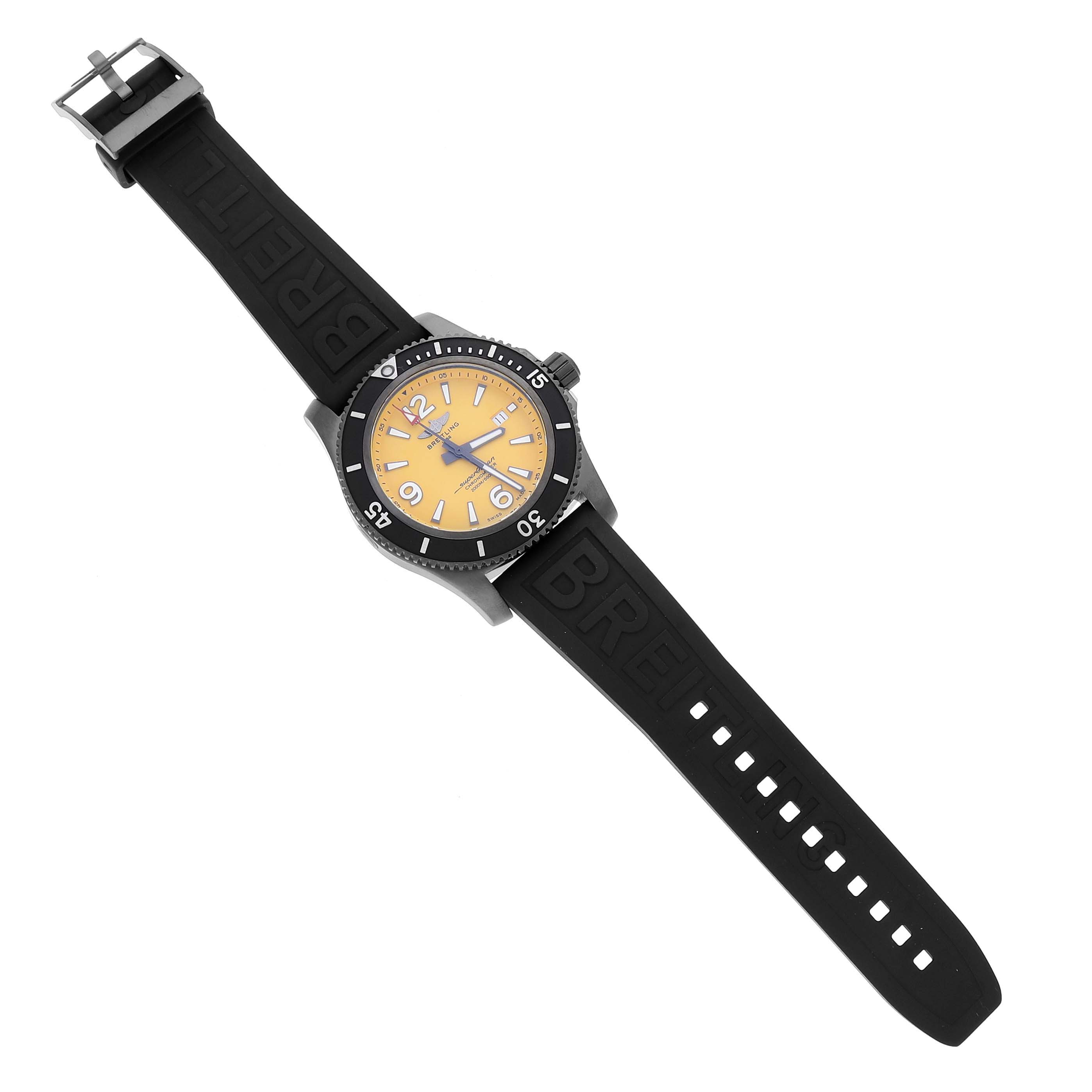 The Breitling Superocean M17368 Men's Stainless Steel Yellow Dial watch is shown from a top-down angle, highlighting the case, bezel, dial, and rubber strap.