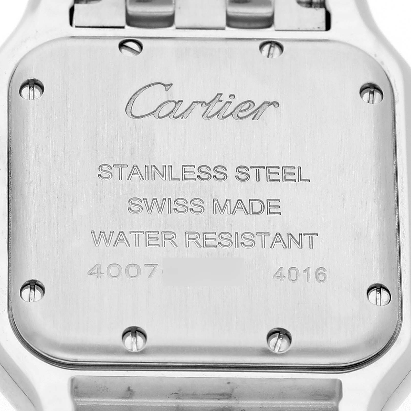 The image shows the back of the Cartier Panthere W4PN0008 Women's Stainless Steel Silver Dial watch, displaying inscriptions and screws on its stainless steel casing.
