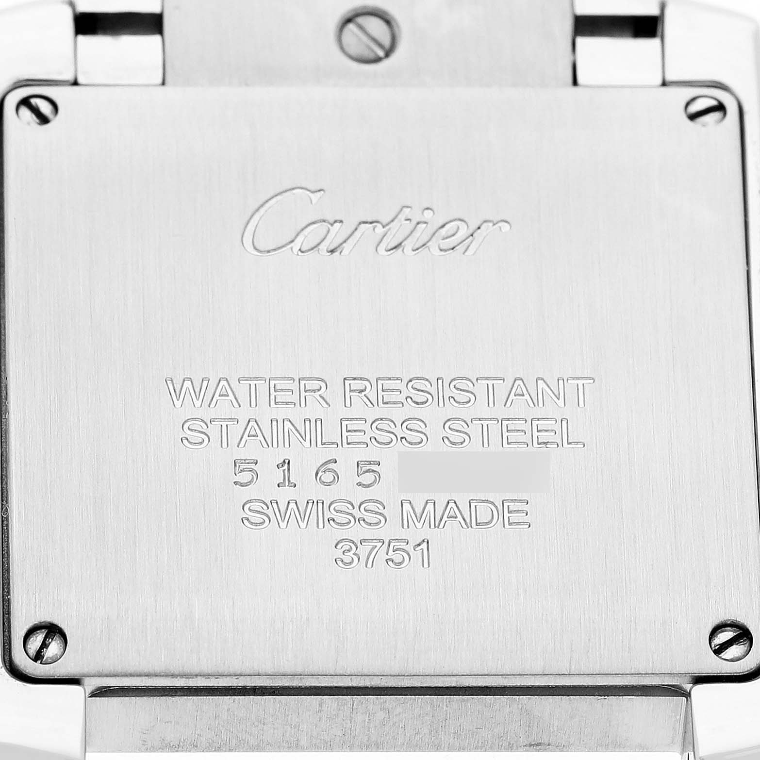 The image shows the back of a Cartier Tank Française watch, featuring engraved specifications and branding.