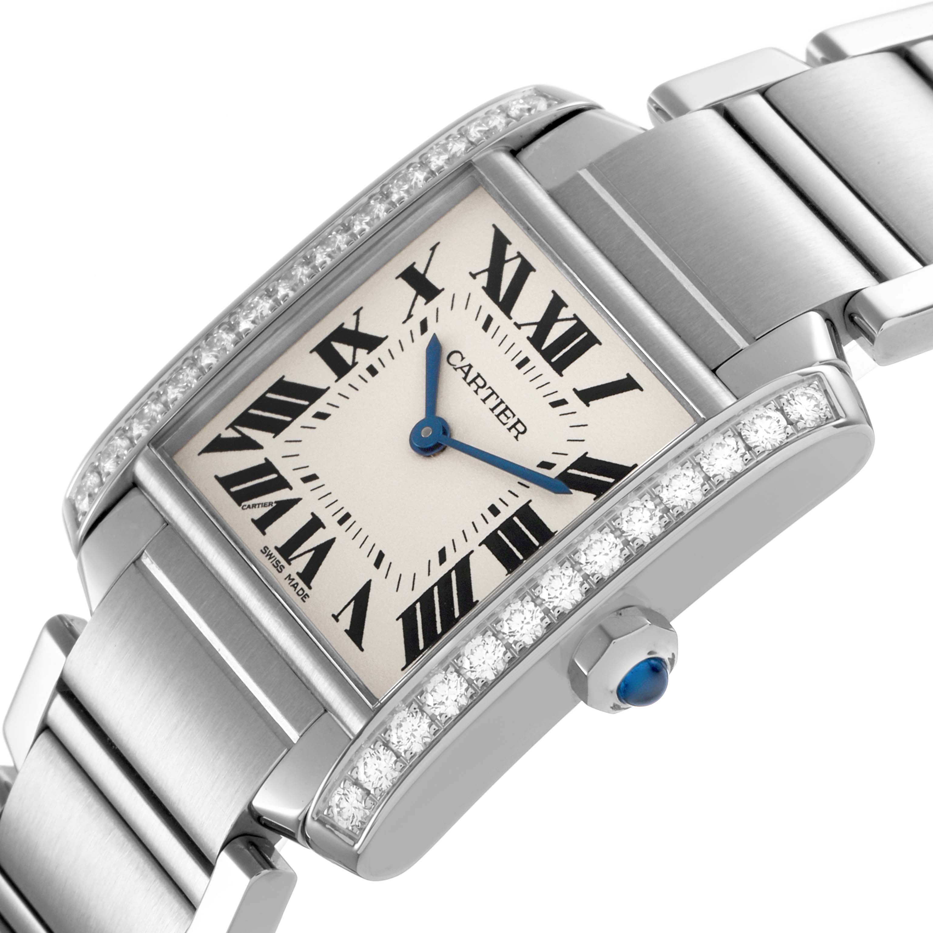 The Cartier Tank Francaise W4TA0009 Women's Stainless Steel Silver Dial watch is shown at an angled view, highlighting its diamond-set bezel, Roman numeral dial, and metal bracelet.