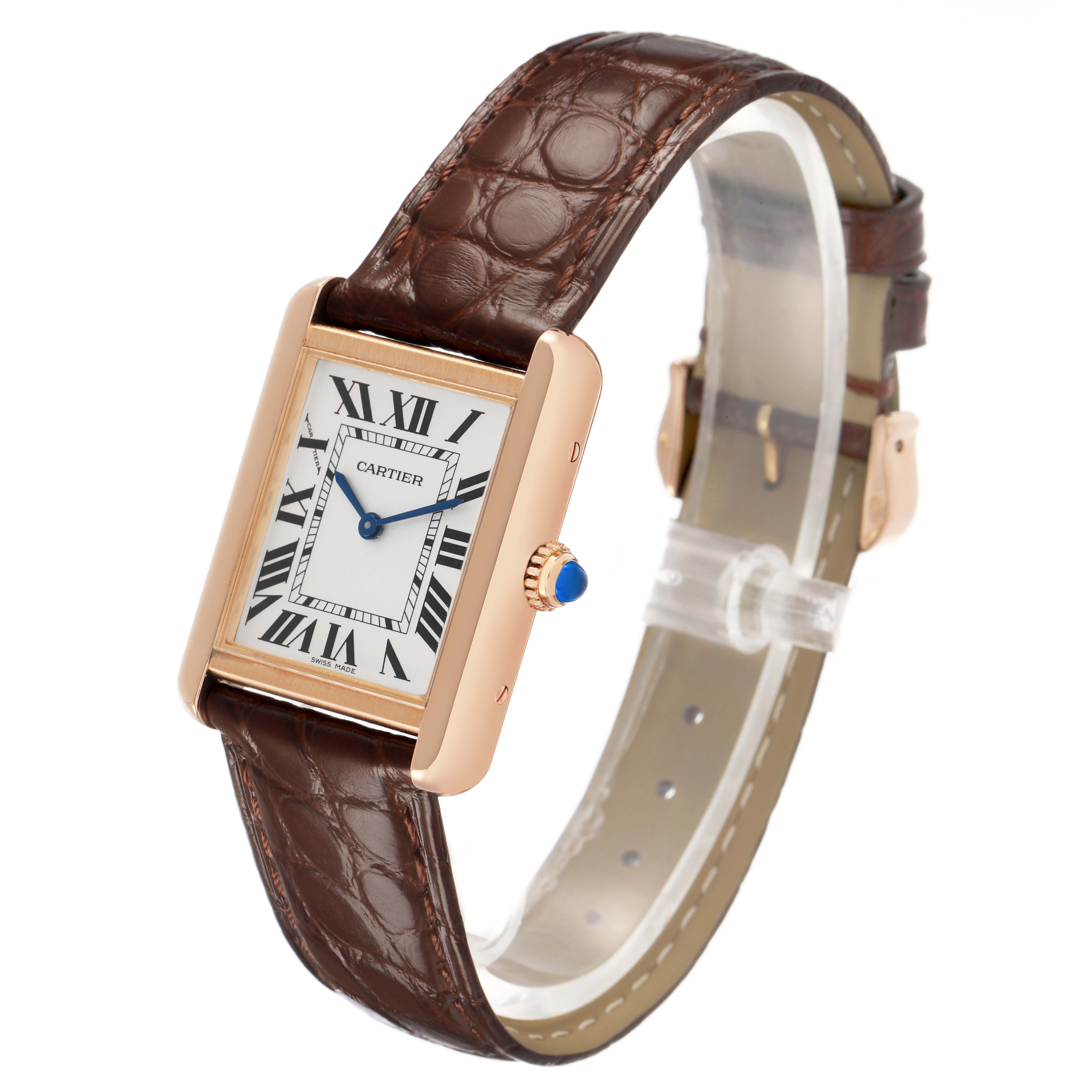 The Cartier Tank Solo W5200002 Women's Steel and Gold (two tone) Silver Dial watch is shown at a three-quarter angle, highlighting its face, case, crown, and leather strap.