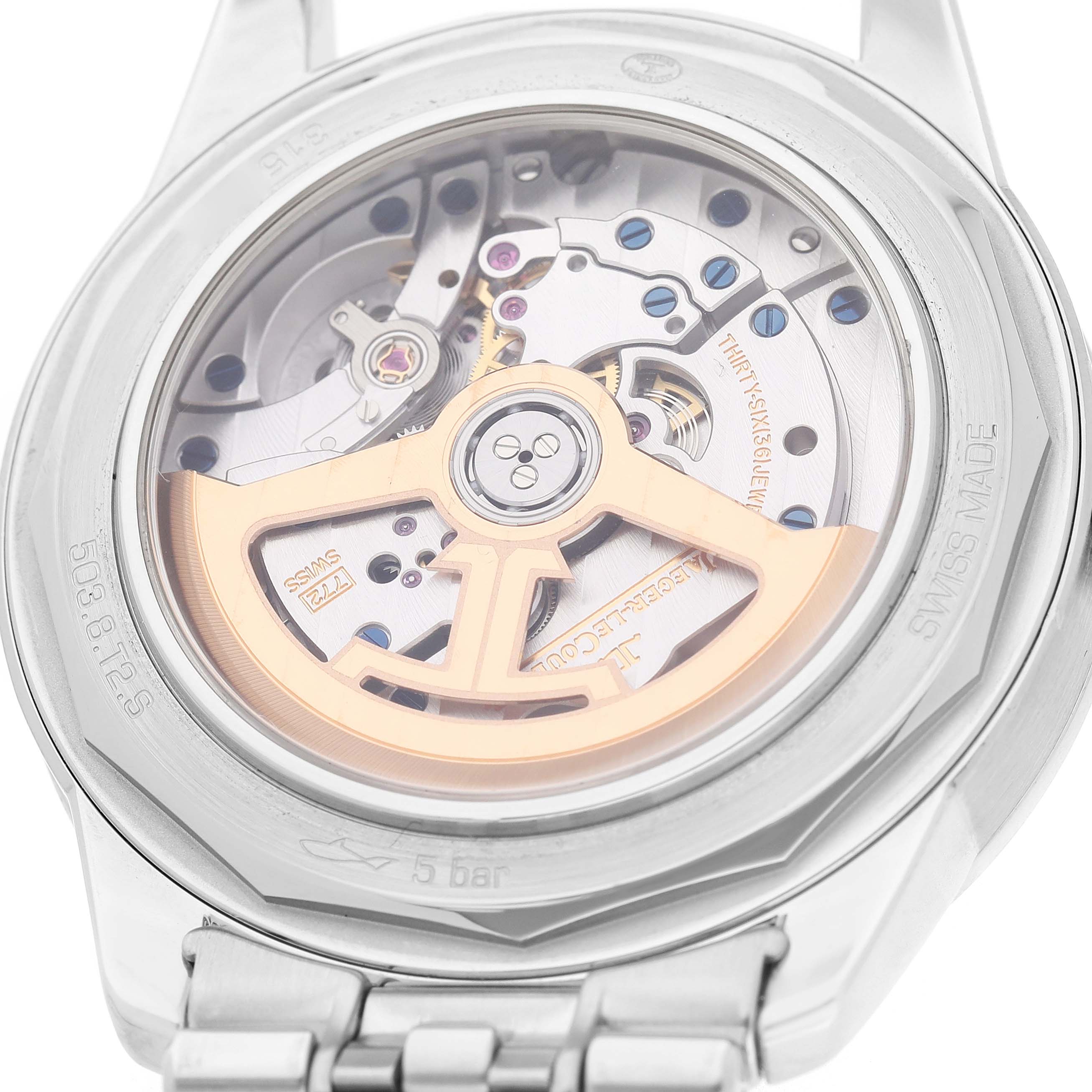The image shows the back of a Jaeger LeCoultre Geophysic Q8108420 Men's Stainless Steel Blue Dial watch, highlighting the movement and rotor through the transparent case back.