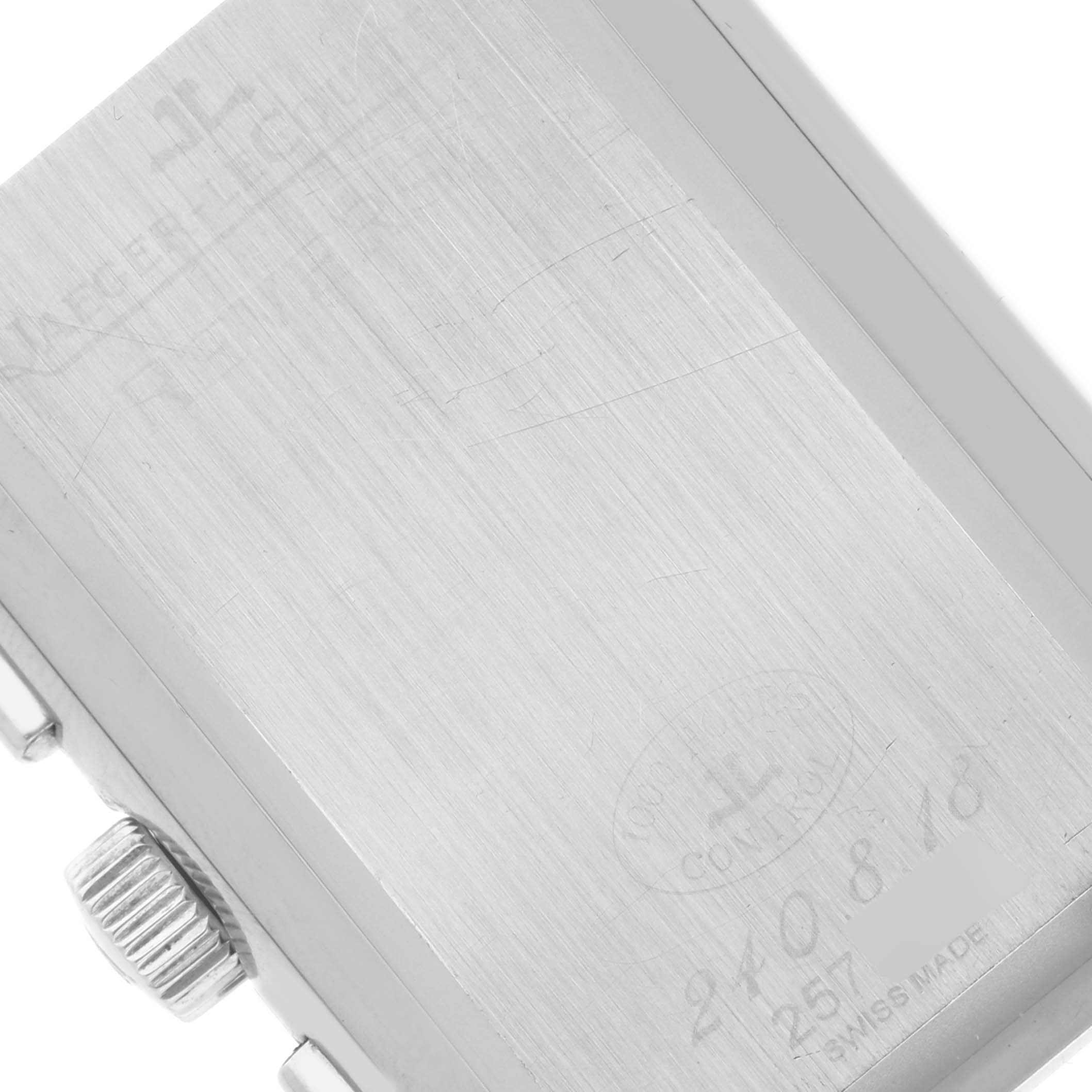 This image shows the back casing and crown of a Jaeger LeCoultre Reverso Q3028420 Men's Stainless Steel Silver Dial Q3028420 Men's Stainless Steel Silver Dial watch in a close-up angle.