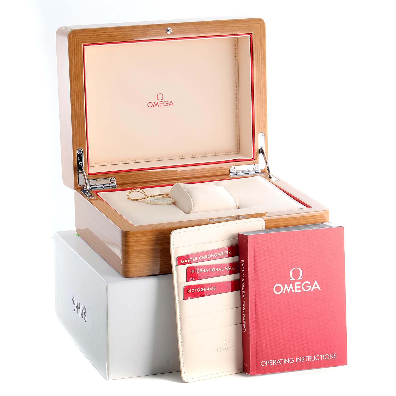 This image shows the open box and accessories for an Omega Planet Ocean 215.30.40.20.03.001 Men
s Stainless Steel Blue Dial 215.30.40.20.03.001 Men
s Stainless Steel Blue Dial watch, including manuals and warranty cards.