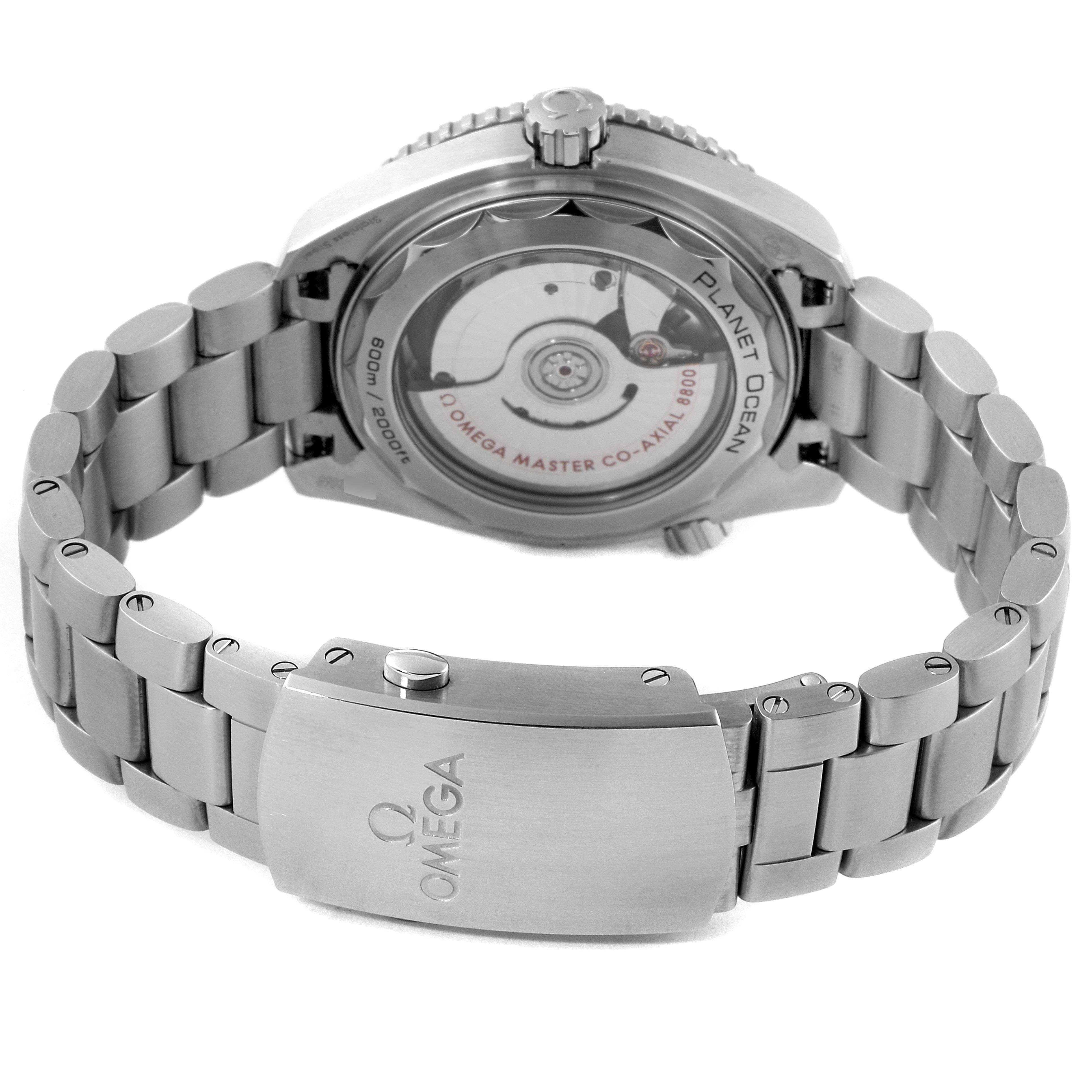 The image shows the back view of the Omega Planet Ocean 215.30.40.20.03.001 Men
s Stainless Steel Blue Dial 215.30.40.20.03.001 Men
s Stainless Steel Blue Dial watch, highlighting its clasp and transparent case back.