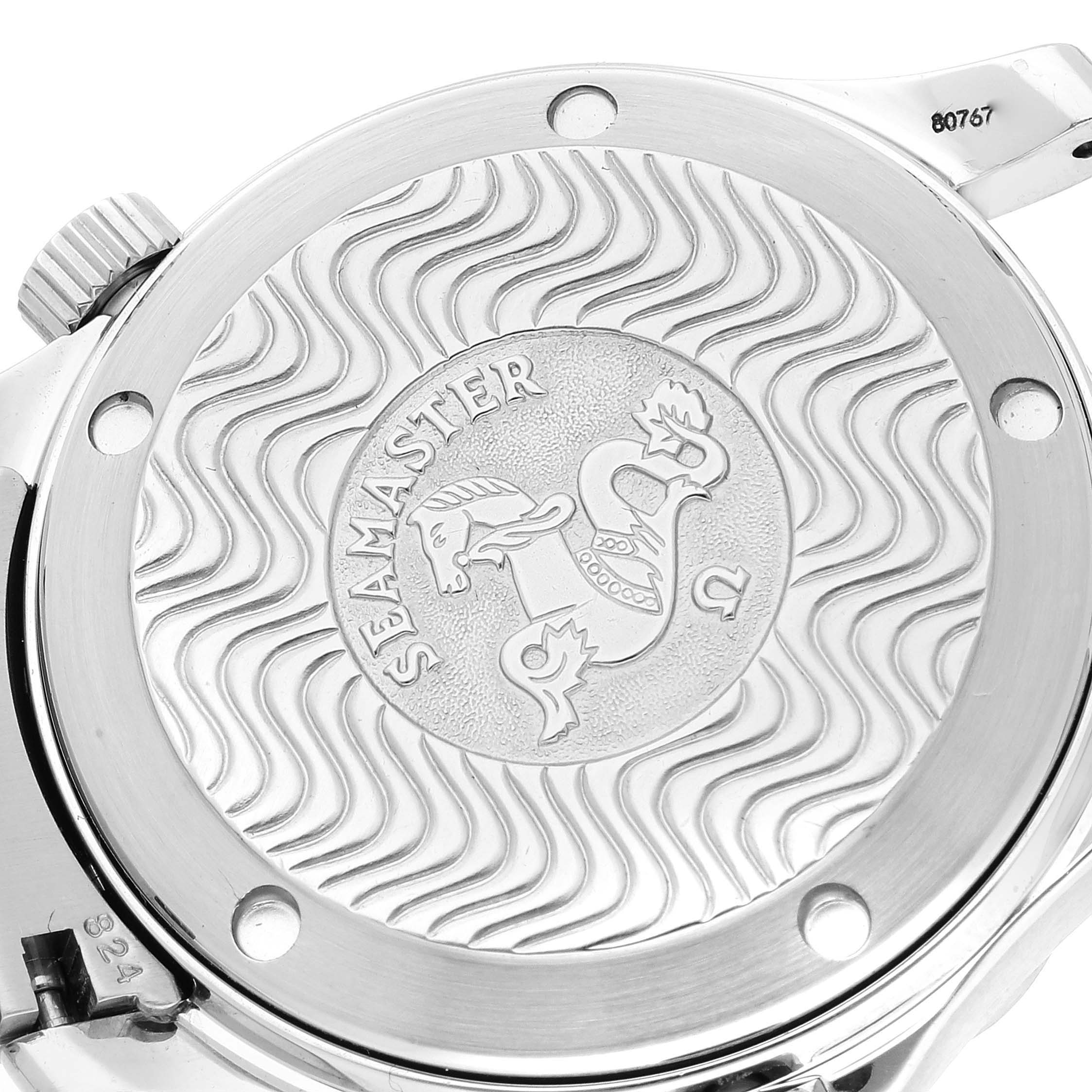 This is a close-up of the case back of an Omega Seamaster 2453.50.00 Men's Steel and Gold (two tone) Black Dial 2453.50.00 Men's Steel and Gold (two tone) Black Dial watch, showing the engraved logo and wave pattern.