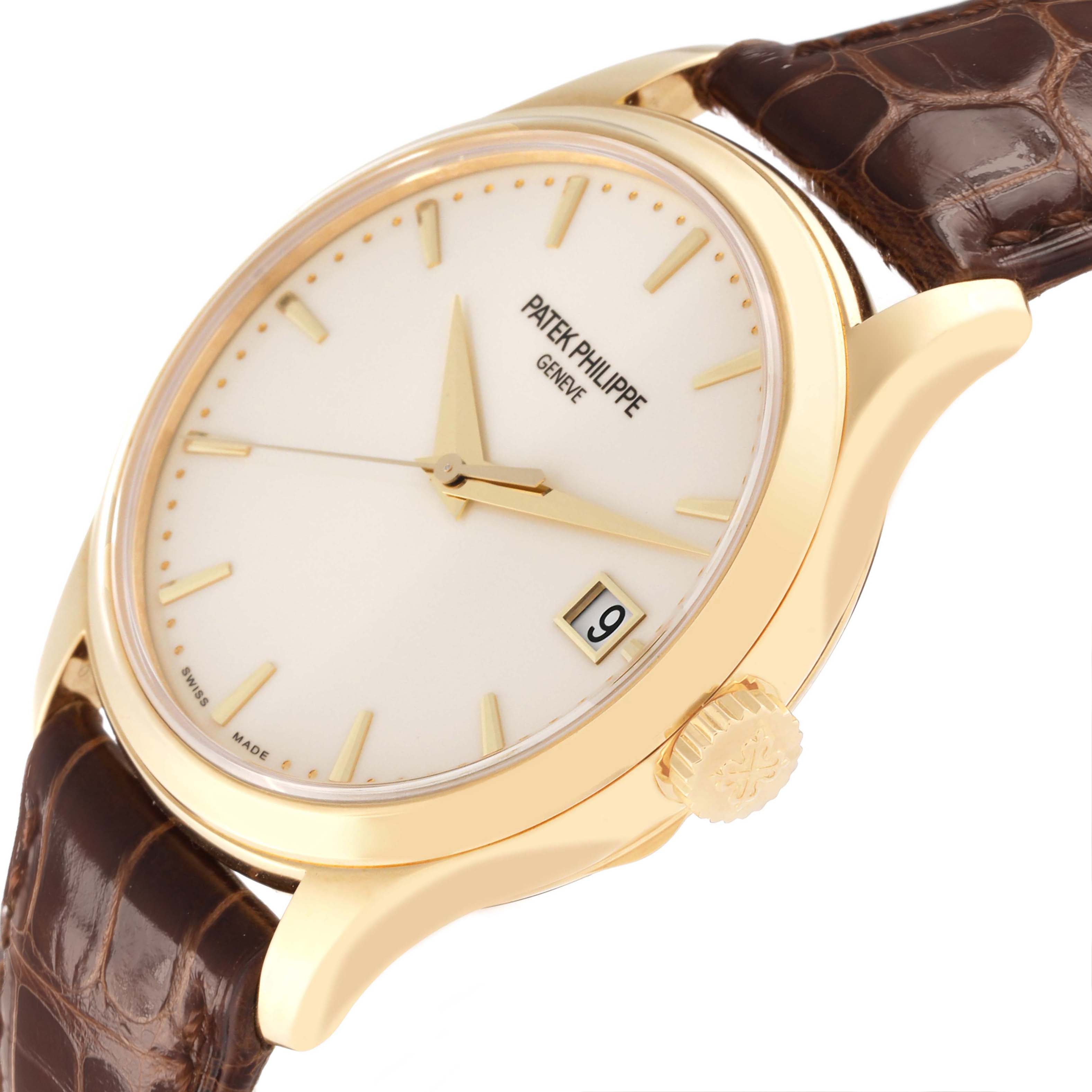 The Patek Philippe Calatrava 5227J Men's Yellow Gold White Dial watch is shown at an angled side view, highlighting its dial, crown, and leather strap.