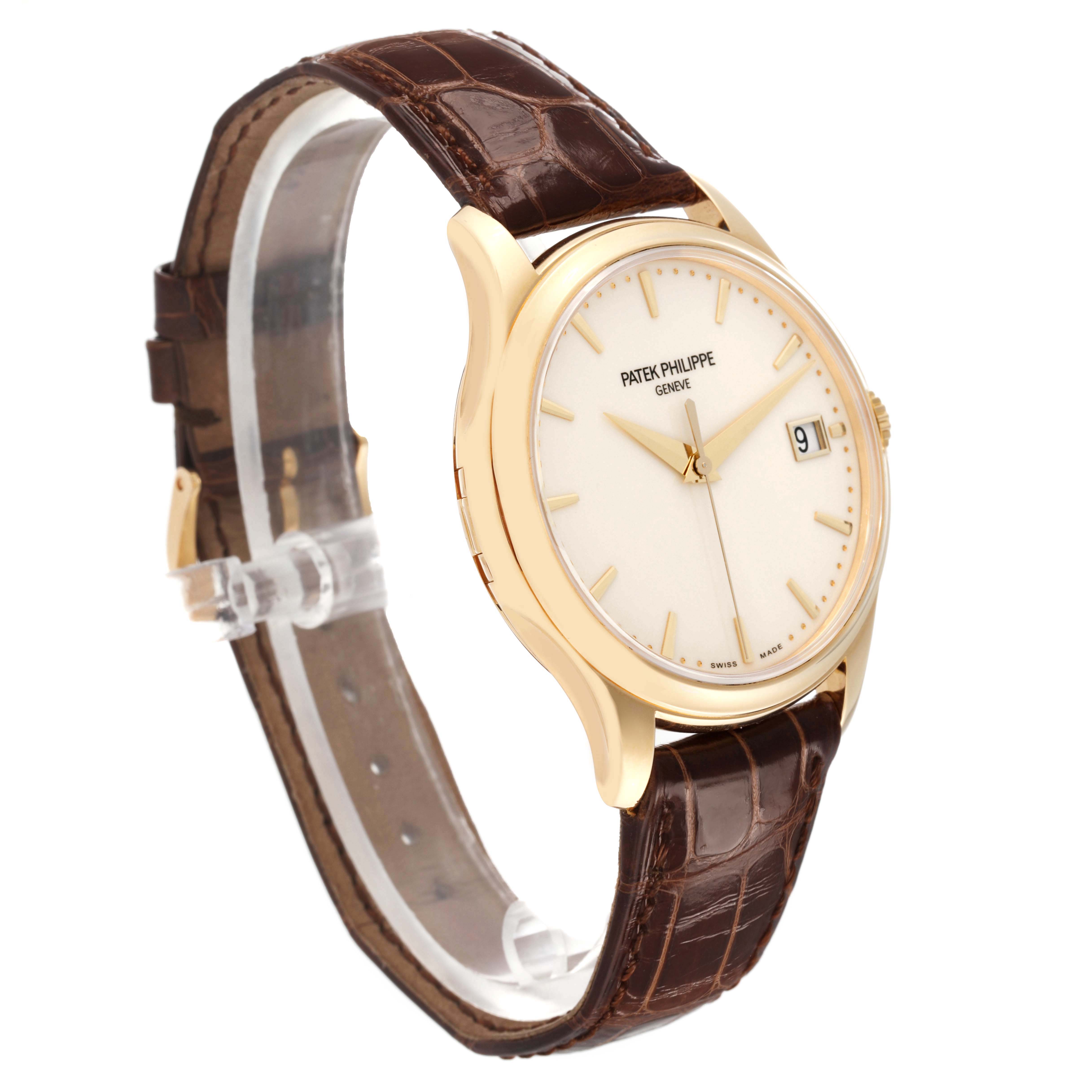 The Patek Philippe Calatrava 5227J Men's Yellow Gold White Dial watch is shown at a slight angle, displaying the dial, case, and brown leather strap.