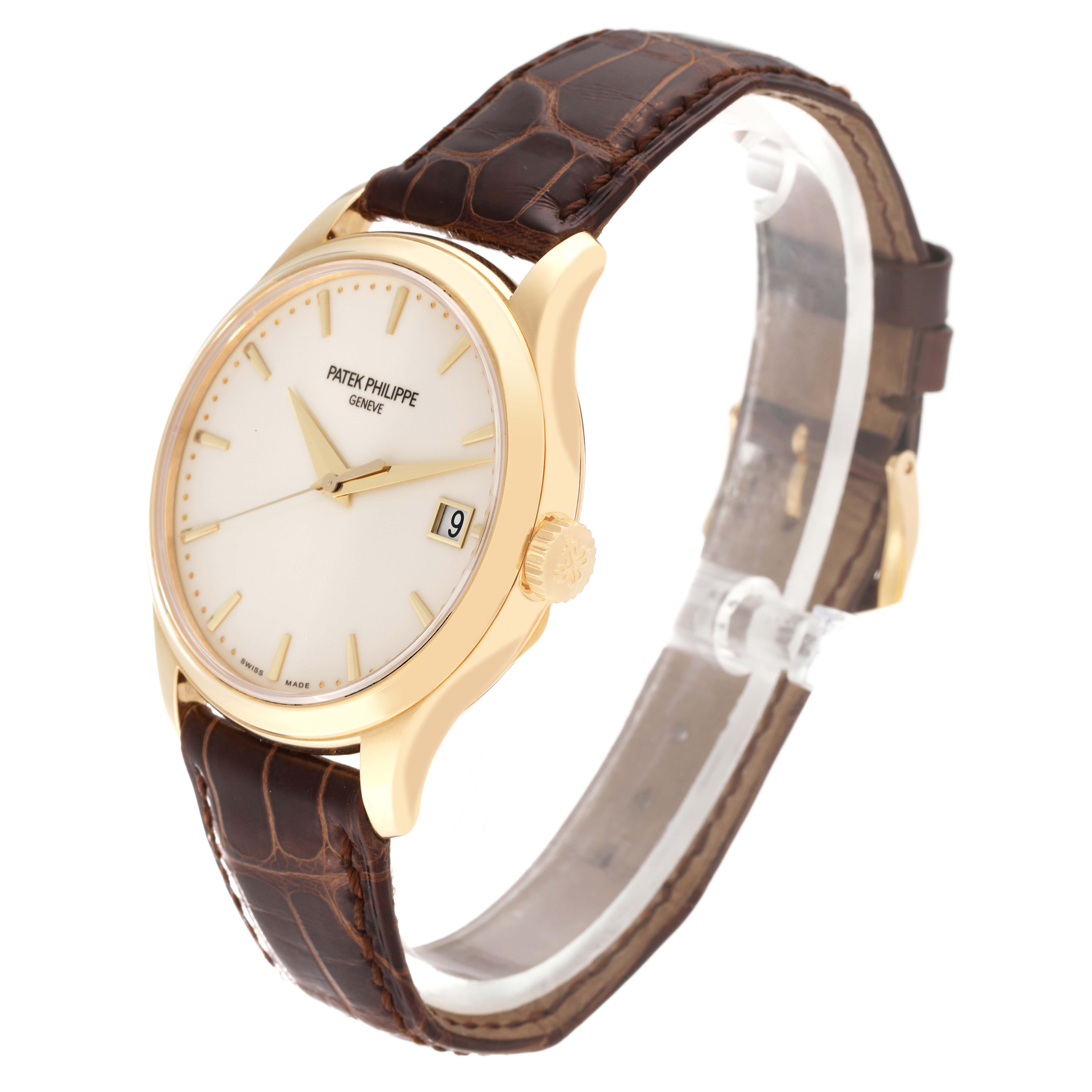 The image shows a Patek Philippe Calatrava 5227J Men's Yellow Gold White Dial 5227J Men's Yellow Gold White Dial watch at a three-quarter angle, highlighting its face, case, crown, and leather strap.