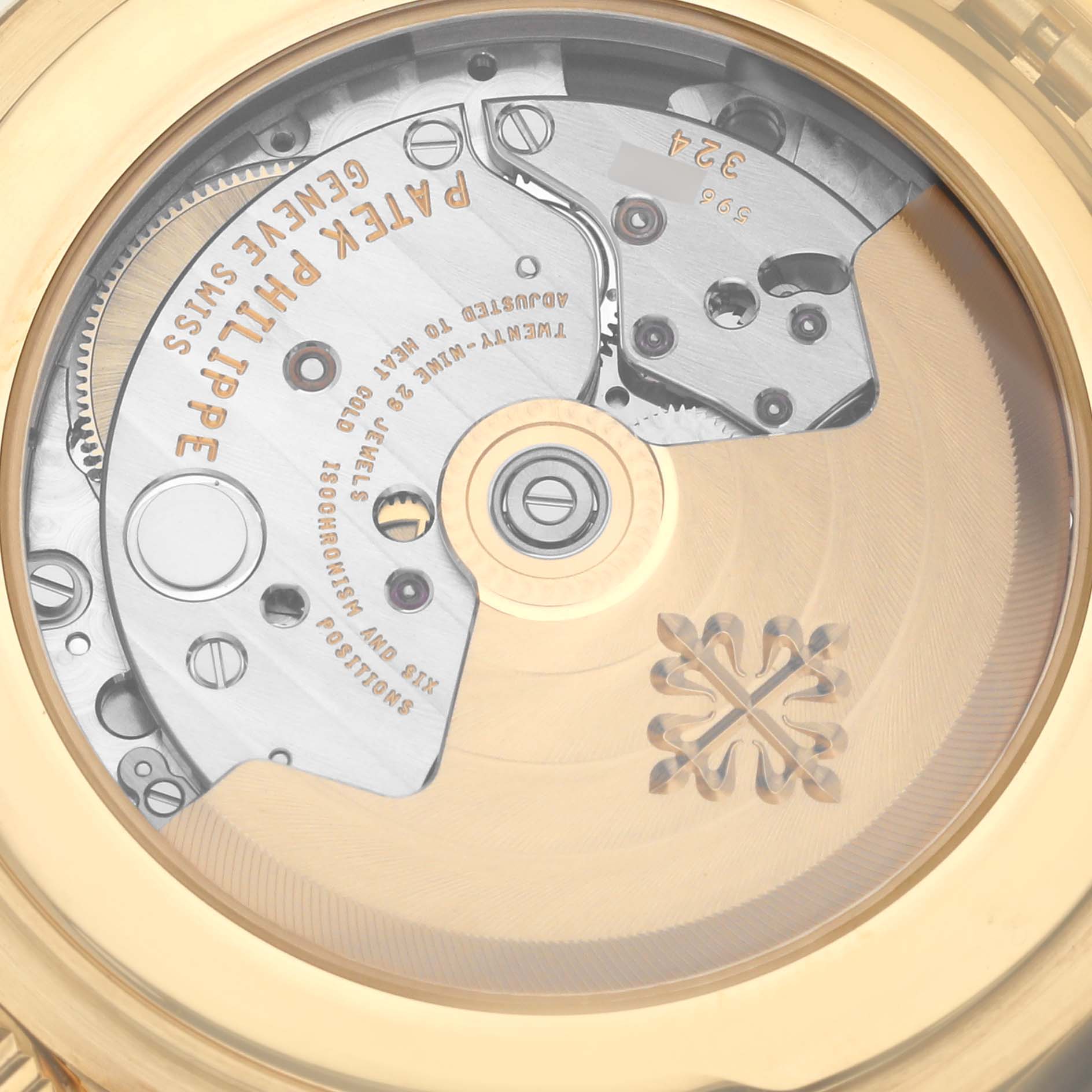 The image shows the movement and rotor through the display case back of a Patek Philippe Calatrava 5227J Men's Yellow Gold White Dial 5227J Men's Yellow Gold White Dial watch.