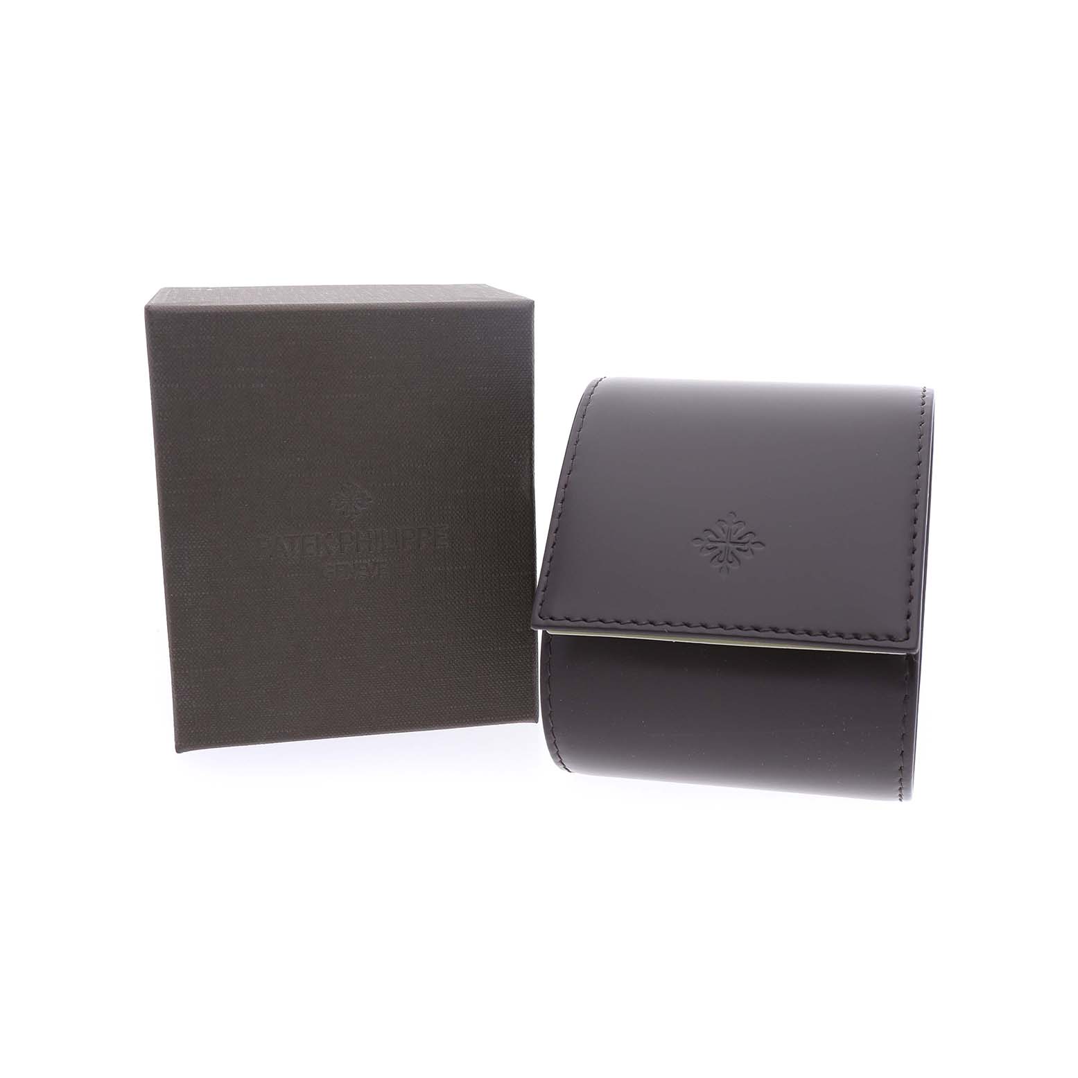 The image shows a Patek Philippe Calatrava 5119 5119R Men's Rose Gold White Dial watch box and a leather case from a front angle.