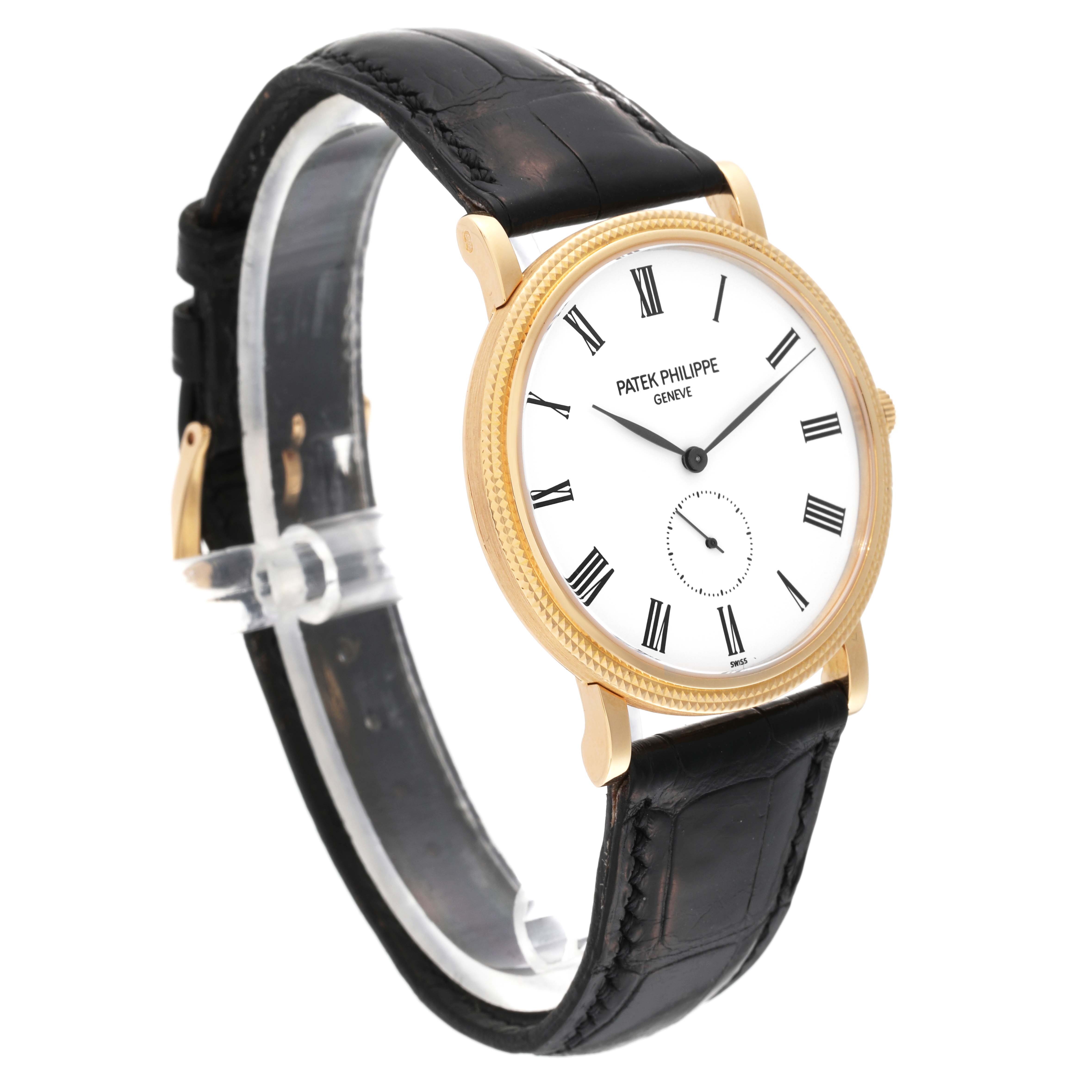 The Patek Philippe Calatrava 5119J Men's Yellow Gold White Dial 5119J Men's Yellow Gold White Dial watch is shown at a three-quarter angle, displaying its face, gold case, and black leather strap.