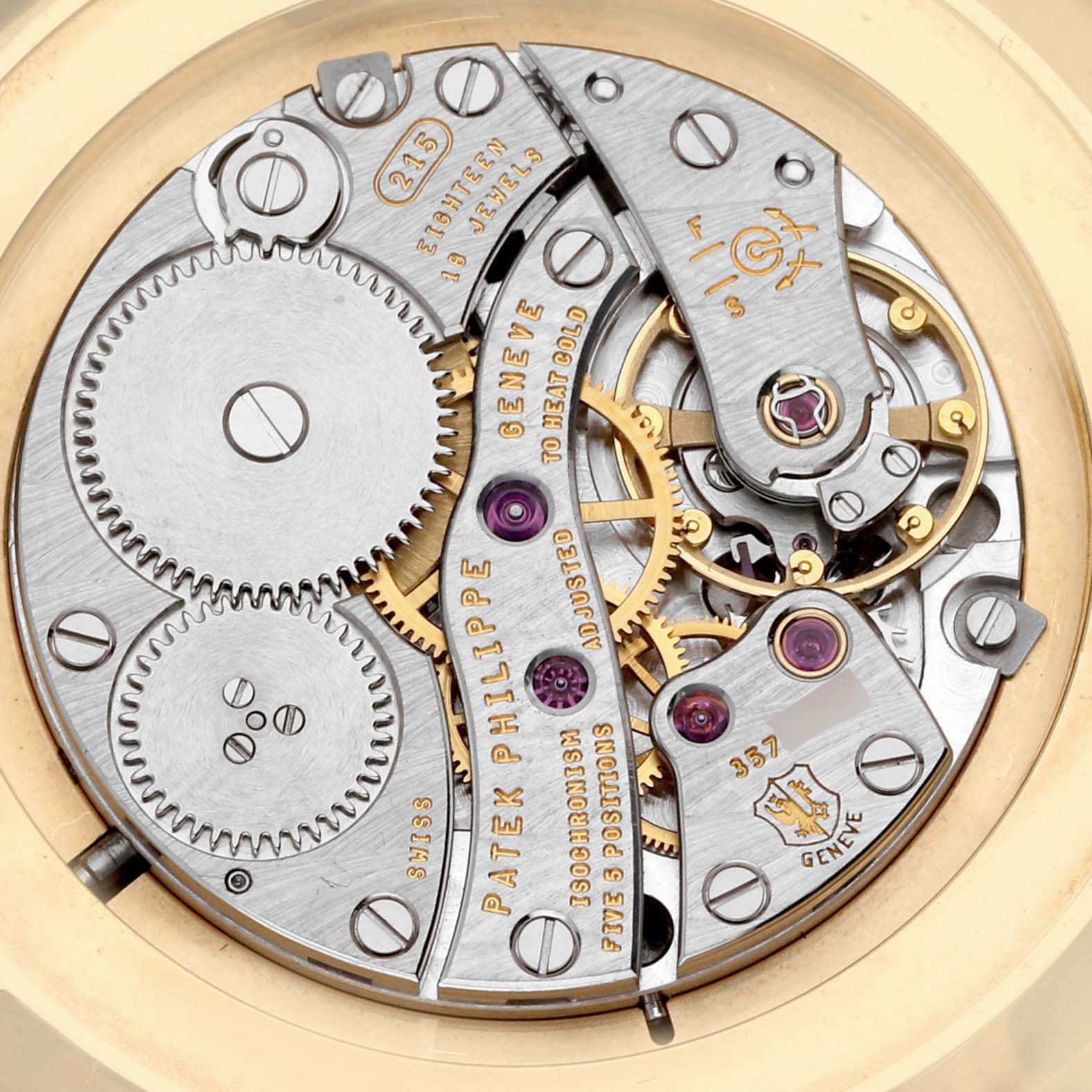 This image shows the intricate movement mechanism of the Patek Philippe Calatrava 5119J Men's Yellow Gold White Dial 5119J Men's Yellow Gold White Dial watch viewed from the back.