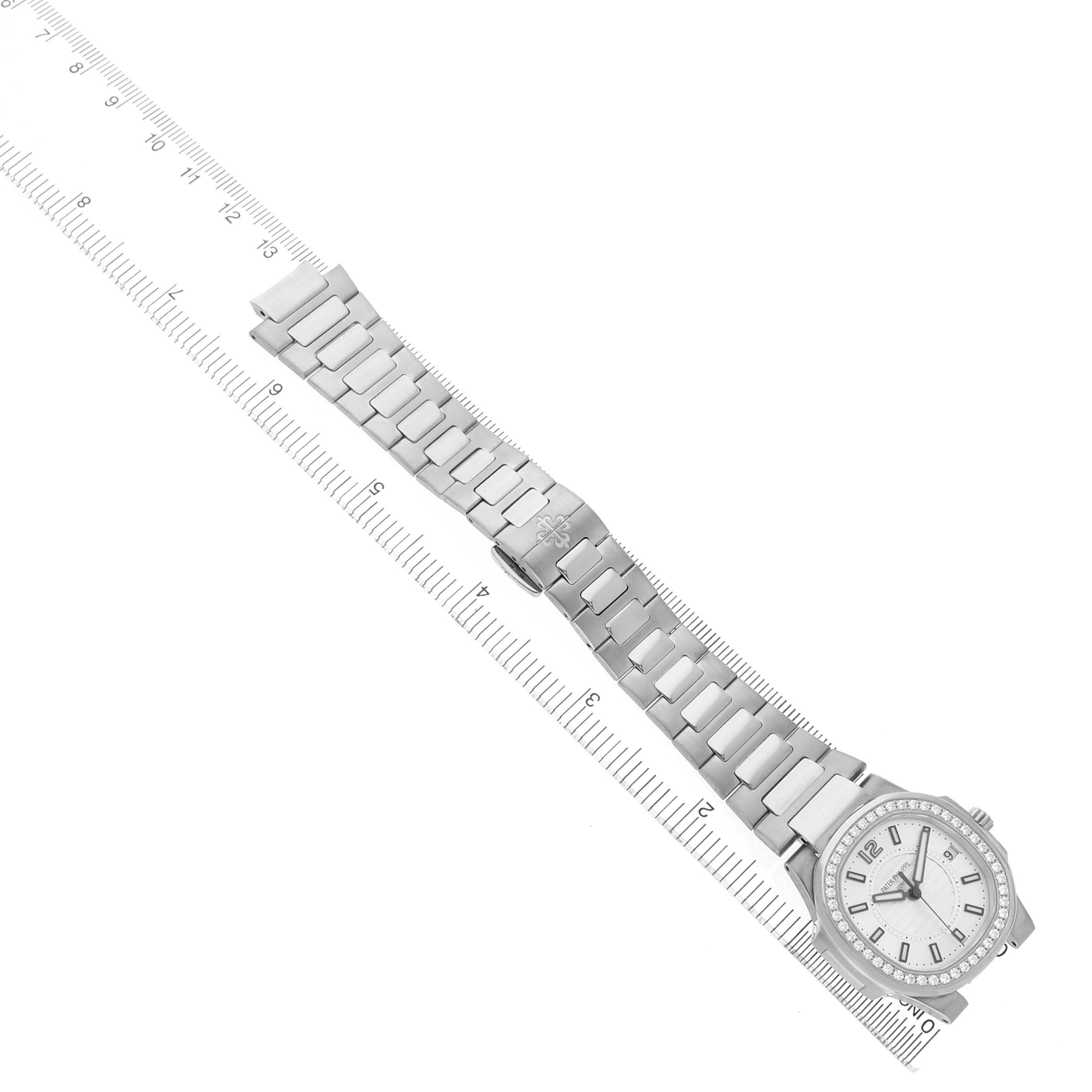 The Patek Philippe Nautilus 7010 7010G Women's White Gold Silver Dial watch is shown from an overhead angle, revealing the bracelet, dial, and bezel.