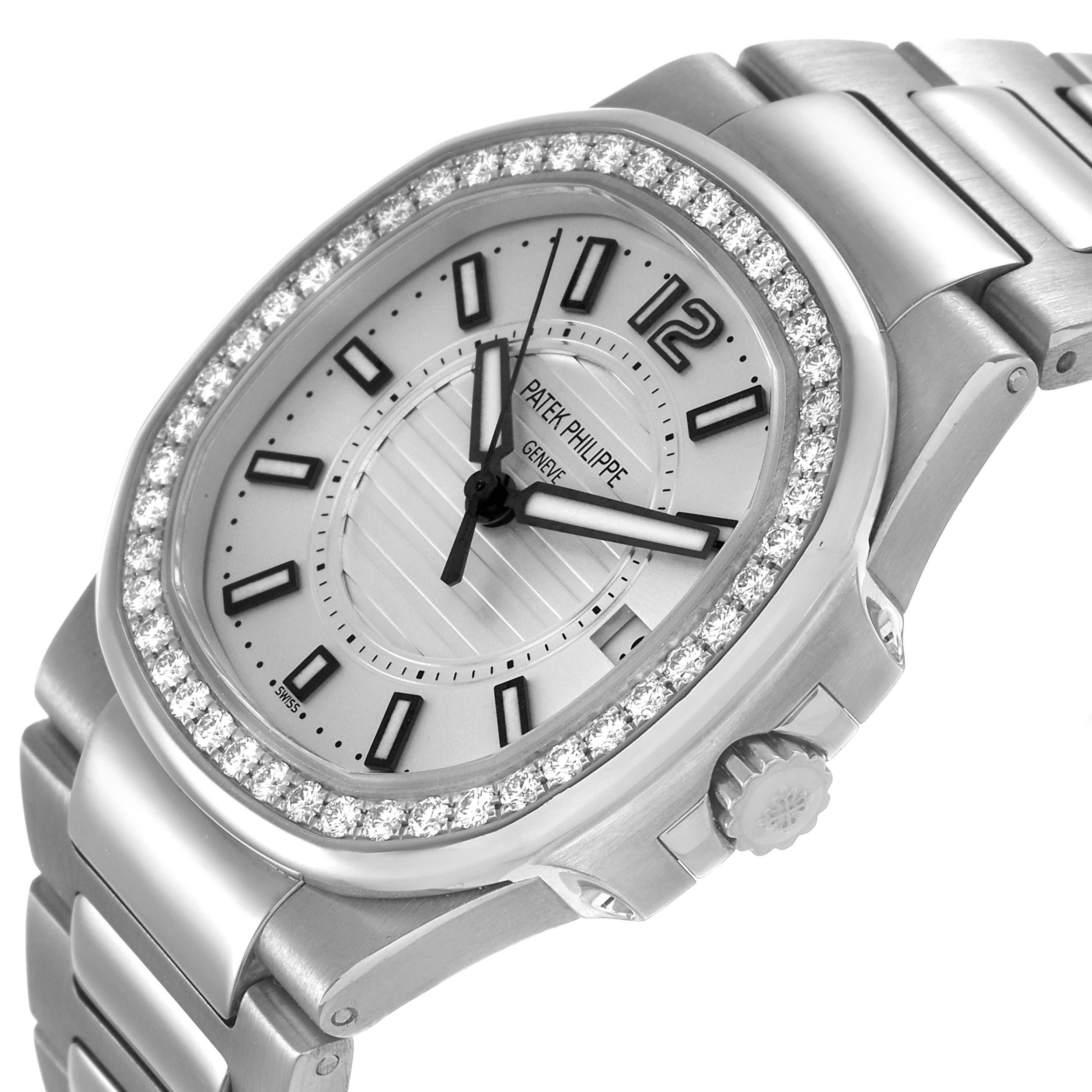 The Patek Philippe Nautilus 7010 7010G Women's White Gold Silver Dial watch is shown at a three-quarter angle, highlighting the diamond bezel, dial, and metal bracelet.