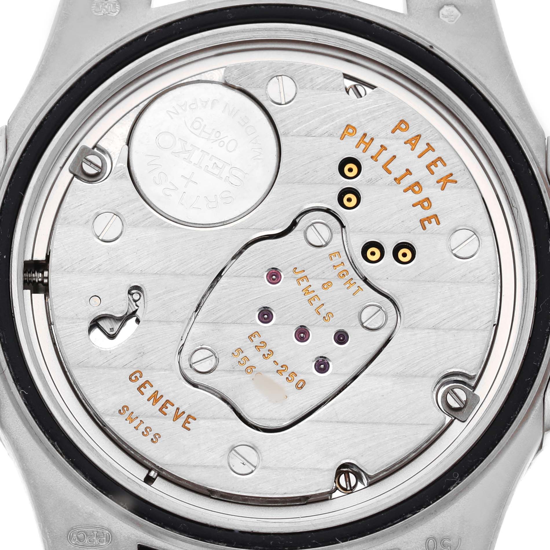 The image shows the back view of the Patek Philippe Nautilus 7010 7010G Women's White Gold Silver Dial model, displaying the internal mechanism and battery compartment.