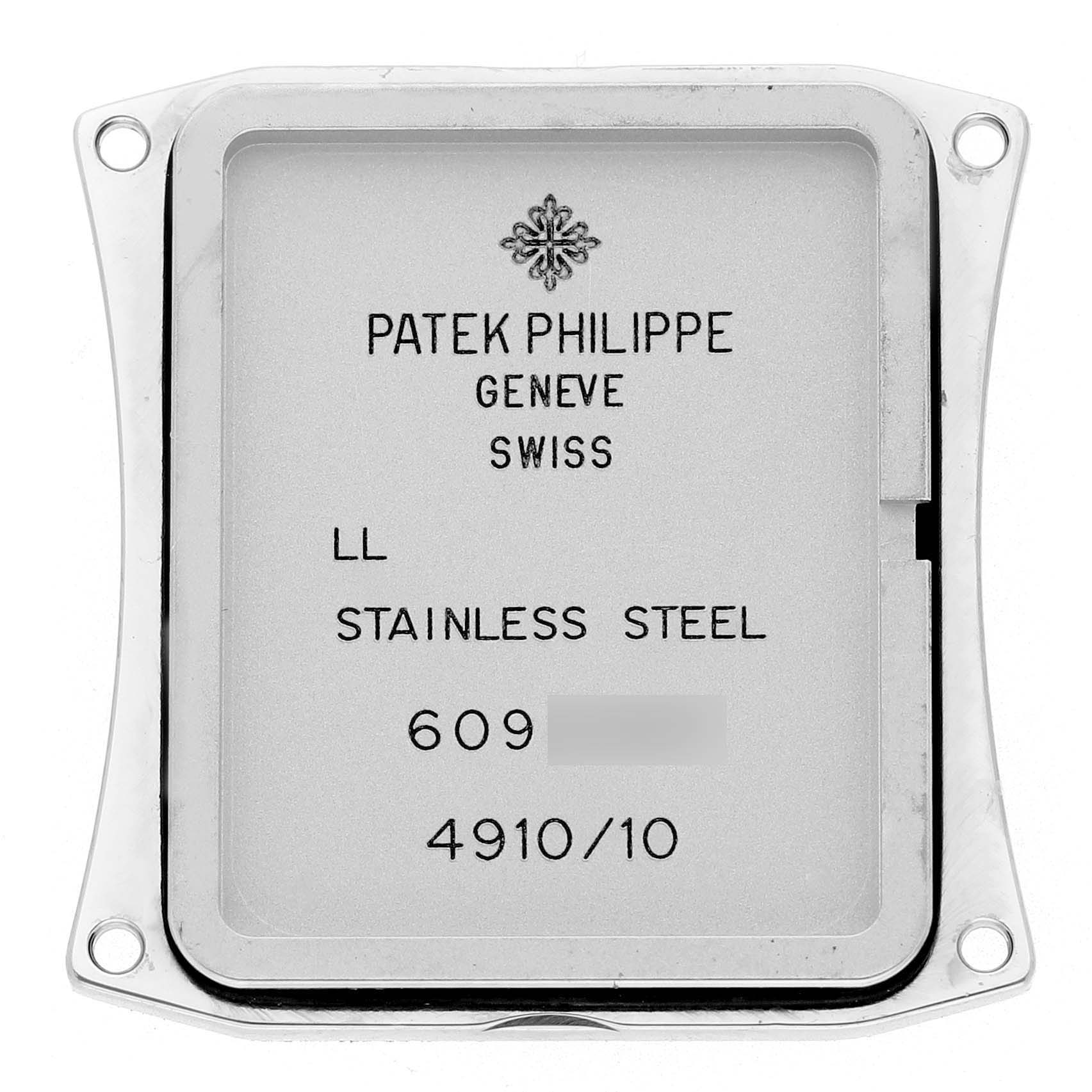 The image shows the back cover of a Patek Philippe Twenty-4 4910/10A-012 Women's Stainless Steel Blue Dial watch, highlighting its stainless steel material and inscriptions.