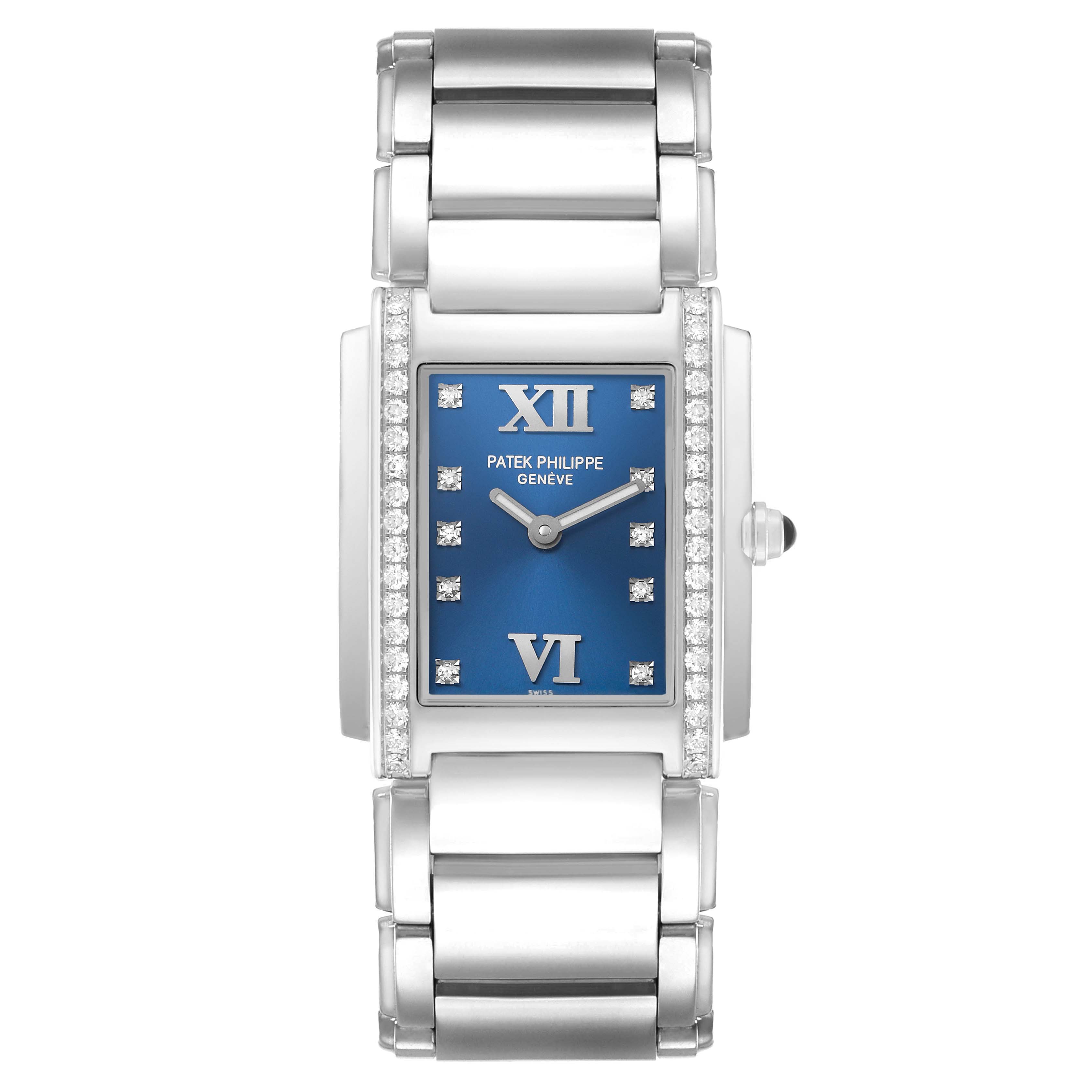 The Patek Philippe Twenty-4 4910/10A-012 Women's Stainless Steel Blue Dial watch is shown from a top-down angle, displaying the blue dial, diamond-set bezel, and steel bracelet.
