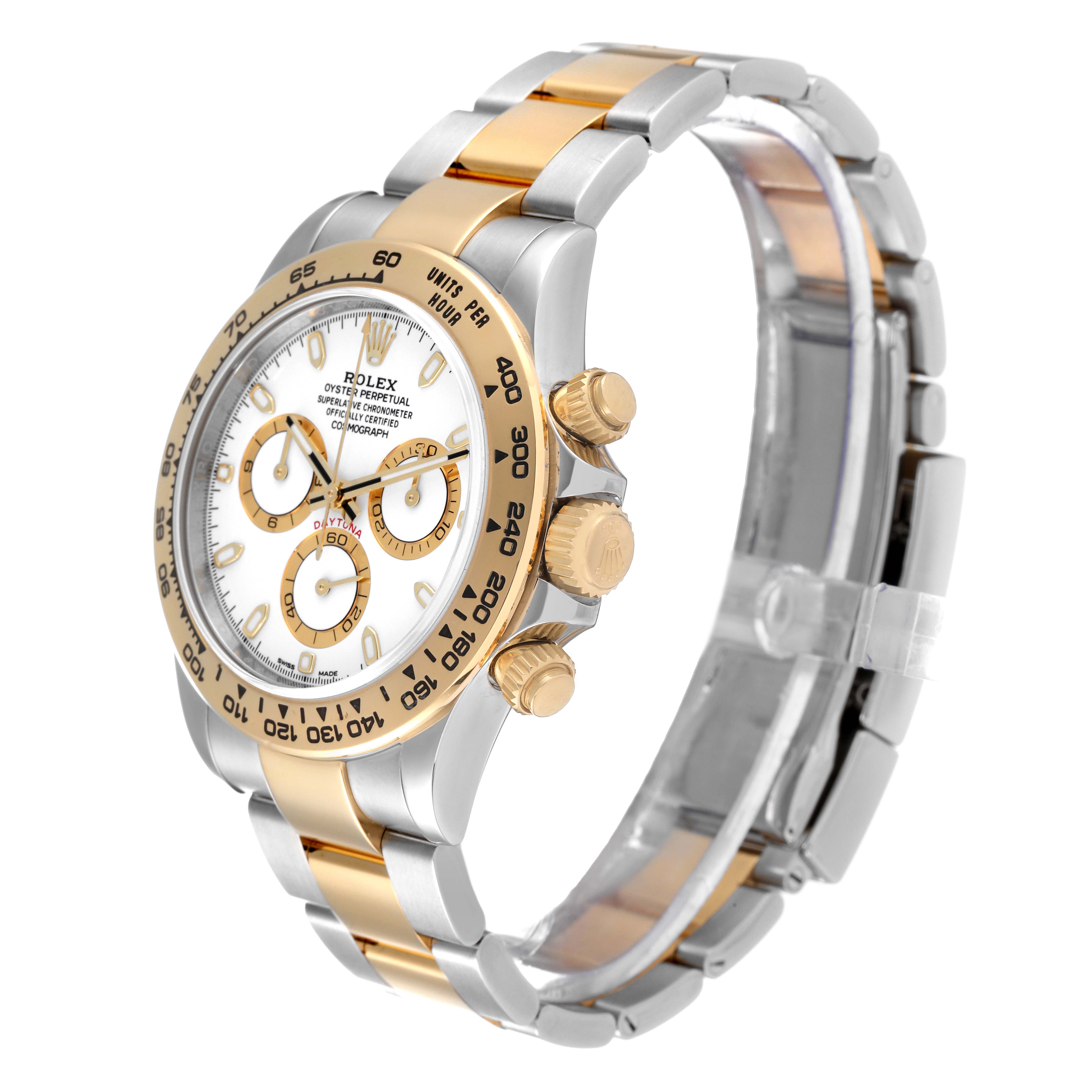 This image shows a Rolex Daytona 116503 Men's Steel and Gold (two tone) White Dial 116503 Men's Steel and Gold (two tone) White Dial watch at a slight side angle, highlighting the bezel, dial, and two-tone bracelet.