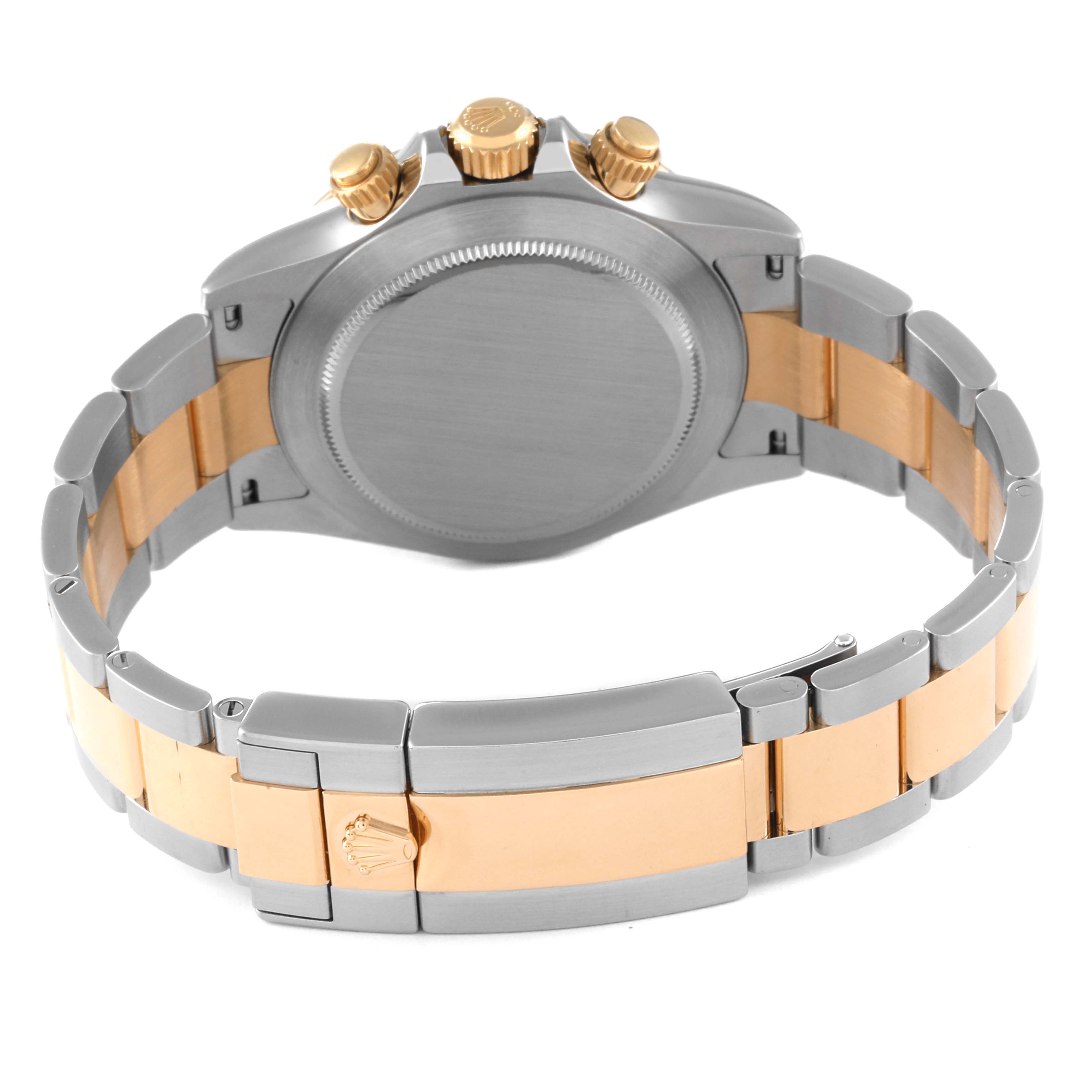 The image shows the back case, crown, and bracelet of a Rolex Daytona 116503 Men's Steel and Gold (two tone) White Dial 116503 Men's Steel and Gold (two tone) White Dial watch.
