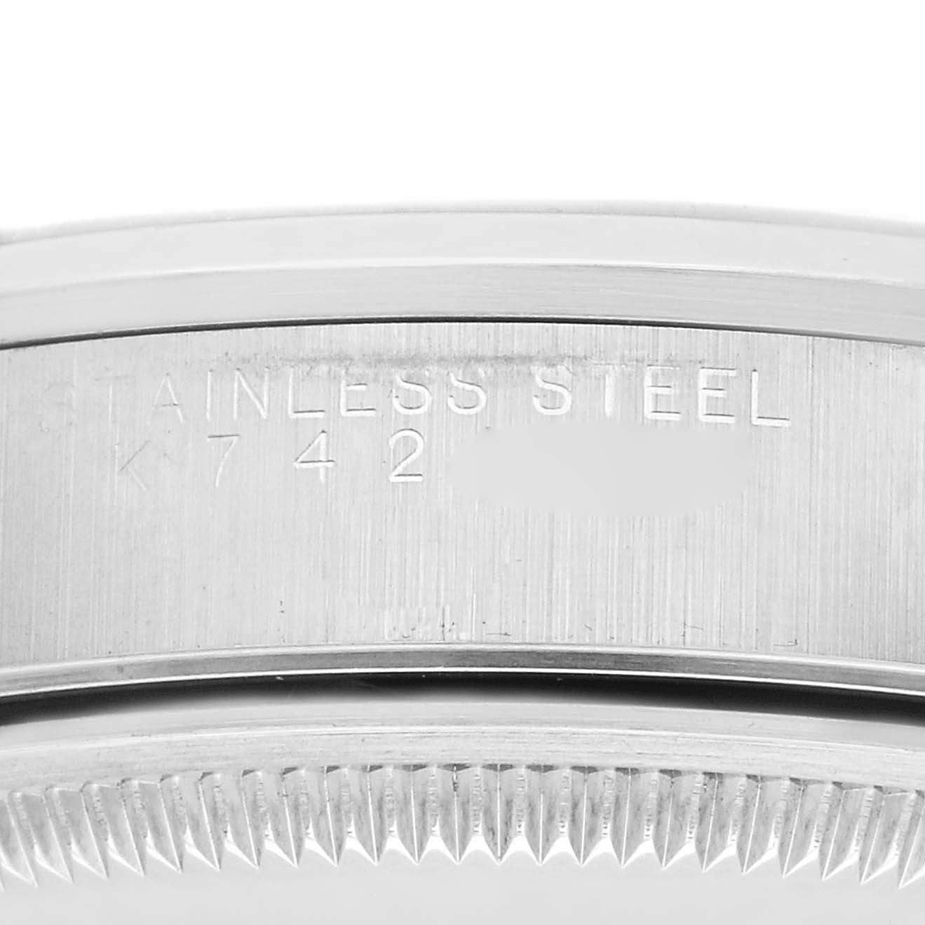This image shows a close-up of the engraved case side of the Rolex Date 15200 Men
s Stainless Steel Blue Dial 15200 Men
s Stainless Steel Blue Dial model in stainless steel.