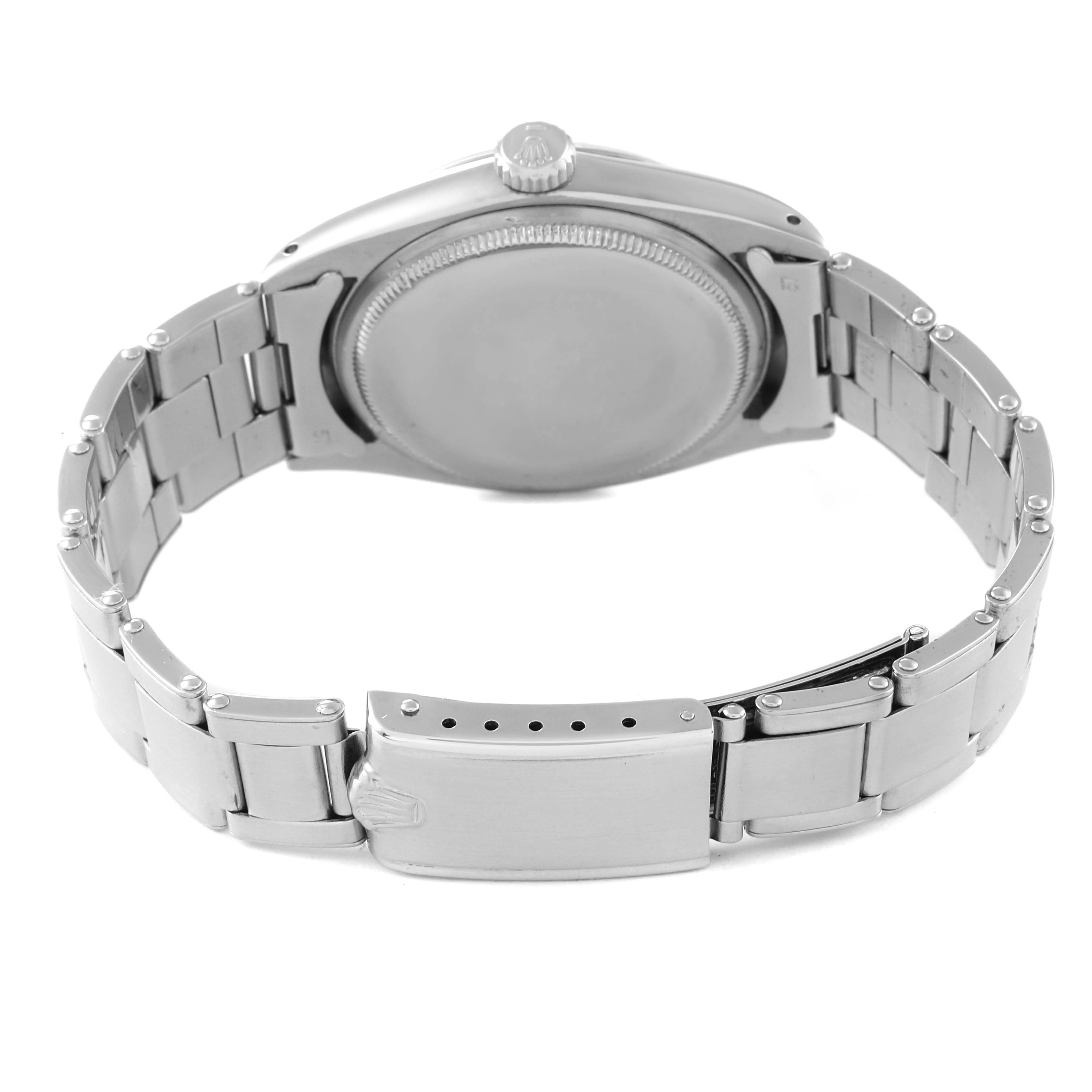 This image shows the back of a Rolex Date 1500 Men's Stainless Steel Silver Dial 1500 Men's Stainless Steel Silver Dial model watch, highlighting its bracelet and closed clasp.
