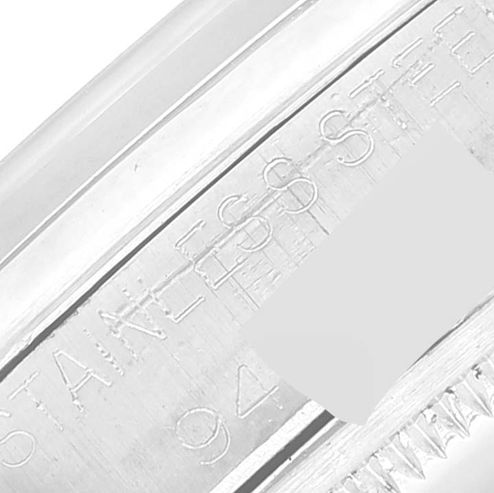 The close-up image shows the engraved stainless steel part of a Rolex Date 1500 Men's Stainless Steel Silver Dial 1500 Men's Stainless Steel Silver Dial model, revealing the case.