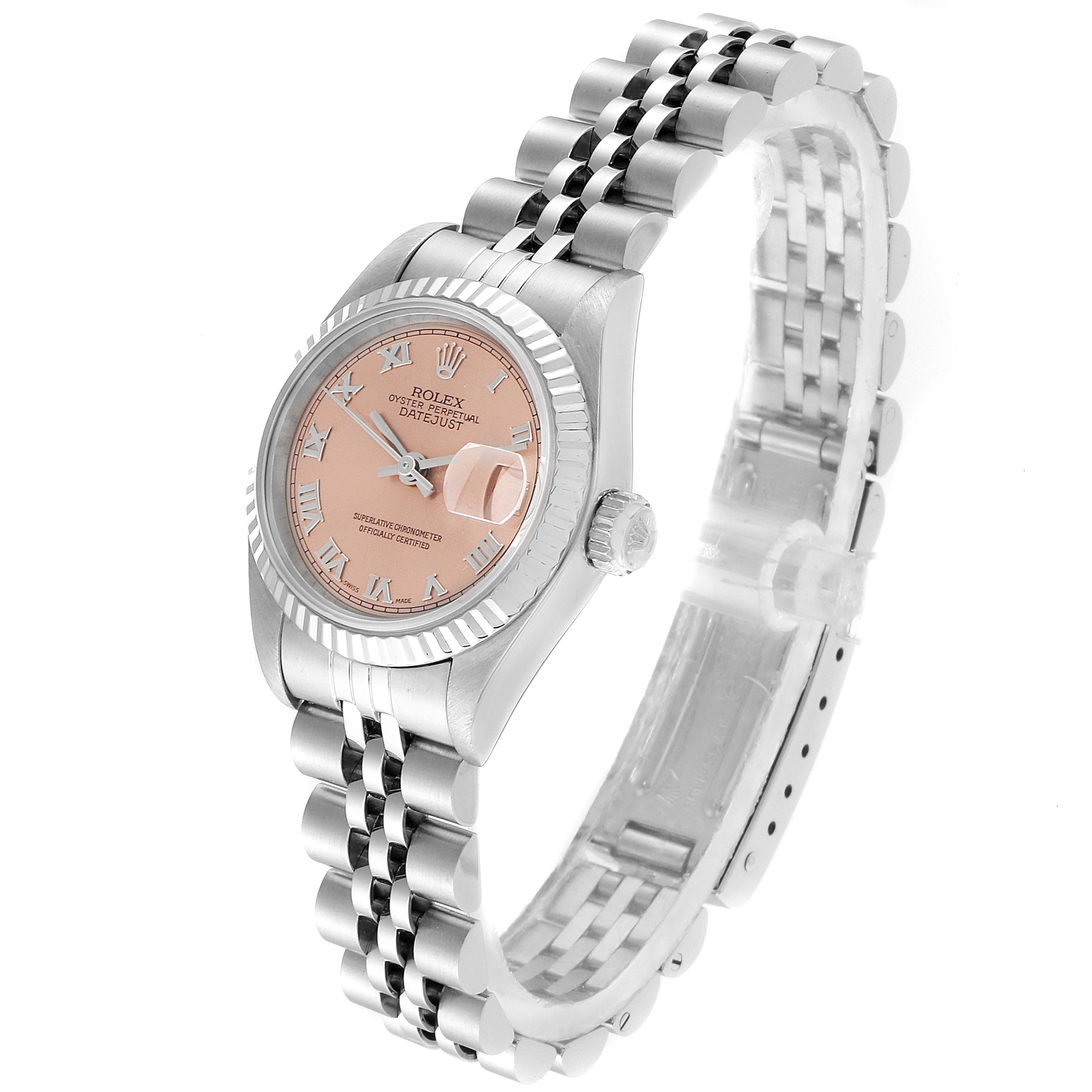 The image shows a Rolex Datejust 69174 Women
s Stainless Steel Pink Dial 69174 Women
s Stainless Steel Pink Dial watch at a three-quarter angle, displaying the face, crown, and part of the bracelet.
