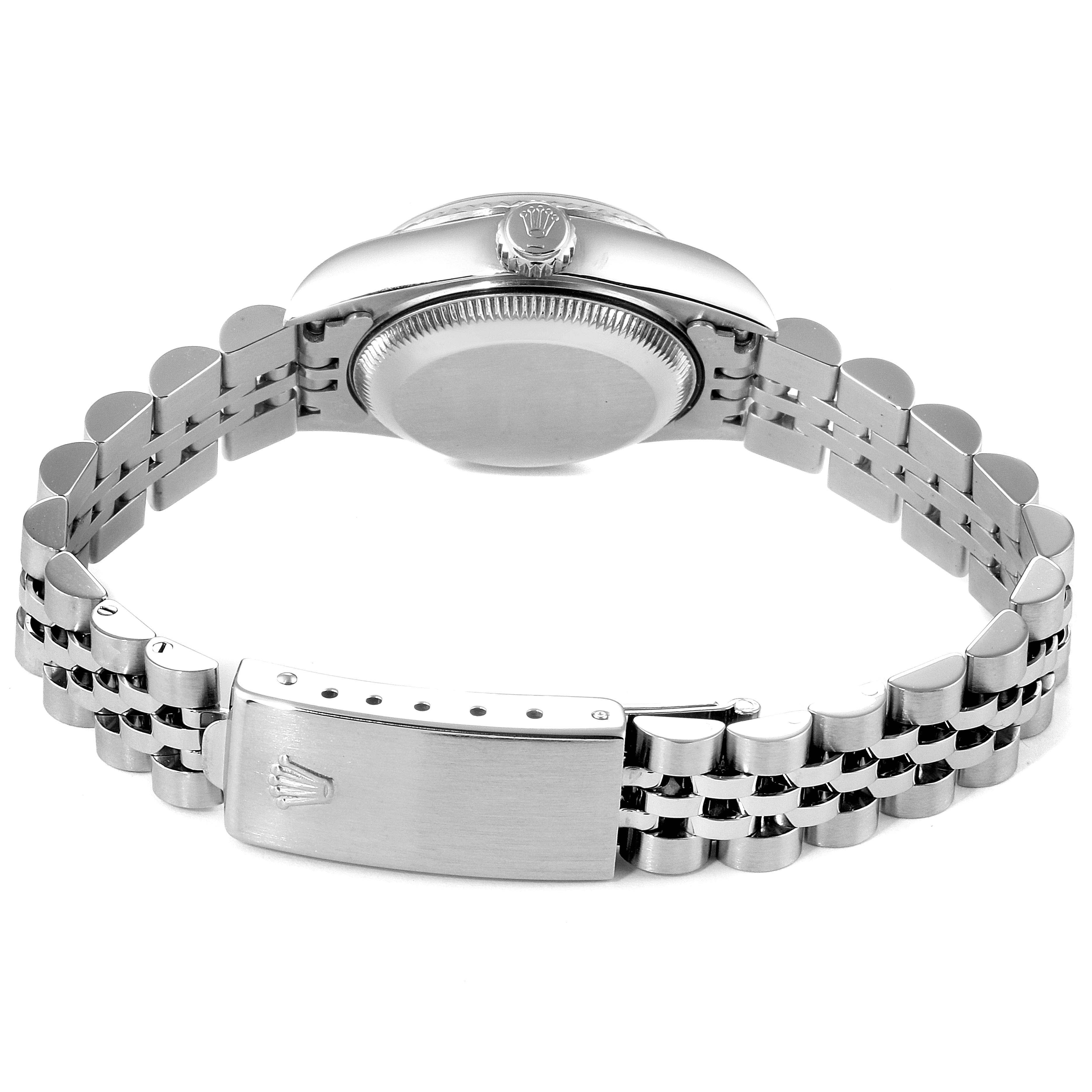 The image shows the back view of a Rolex Datejust 69174 Women
s Stainless Steel Pink Dial 69174 Women
s Stainless Steel Pink Dial watch, focusing on the caseback, crown, and bracelet with a clasp.