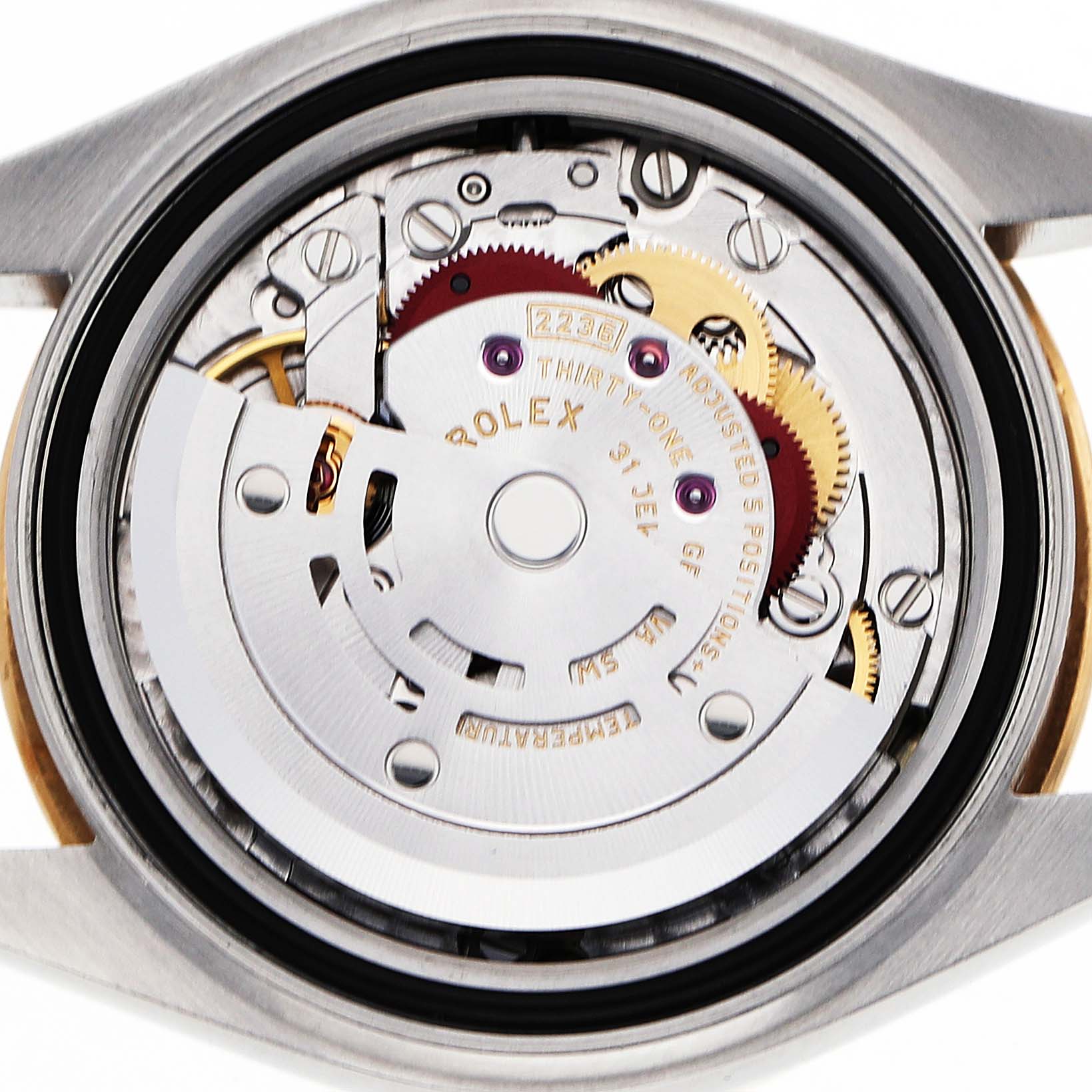 The image shows the back view of a Rolex Datejust 279383 Women's Stainless Steel Champagne Dial watch, highlighting its intricate movement and rotor mechanism.