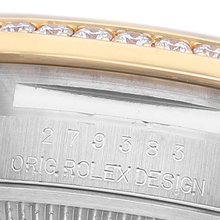 The image shows part of the bezel with diamonds and the engraved serial number on a Rolex Datejust 279383 Women's Stainless Steel Champagne Dial watch.