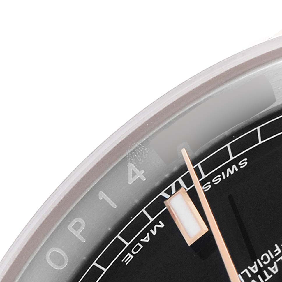 The image shows a close-up angle of the dial, bezel, and minute hand of a Rolex Datejust 116231 Men's Steel and Gold (two tone) Black Dial 116231 Men's Steel and Gold (two tone) Black Dial watch.