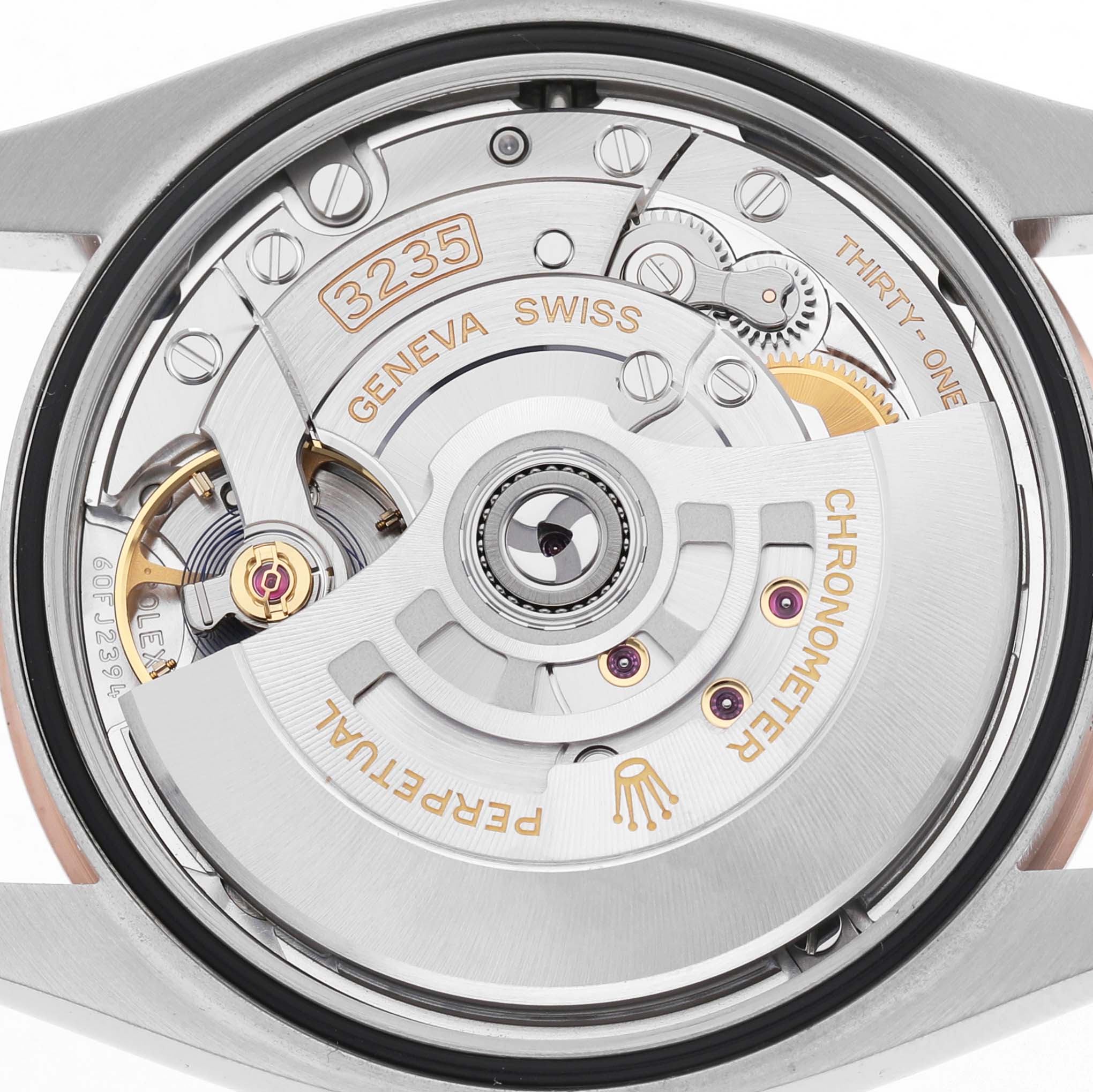 The image shows a back view of the Rolex Datejust 126231 Men's Steel and Gold (two tone) White Dial movement, highlighting the rotor and internal mechanisms.