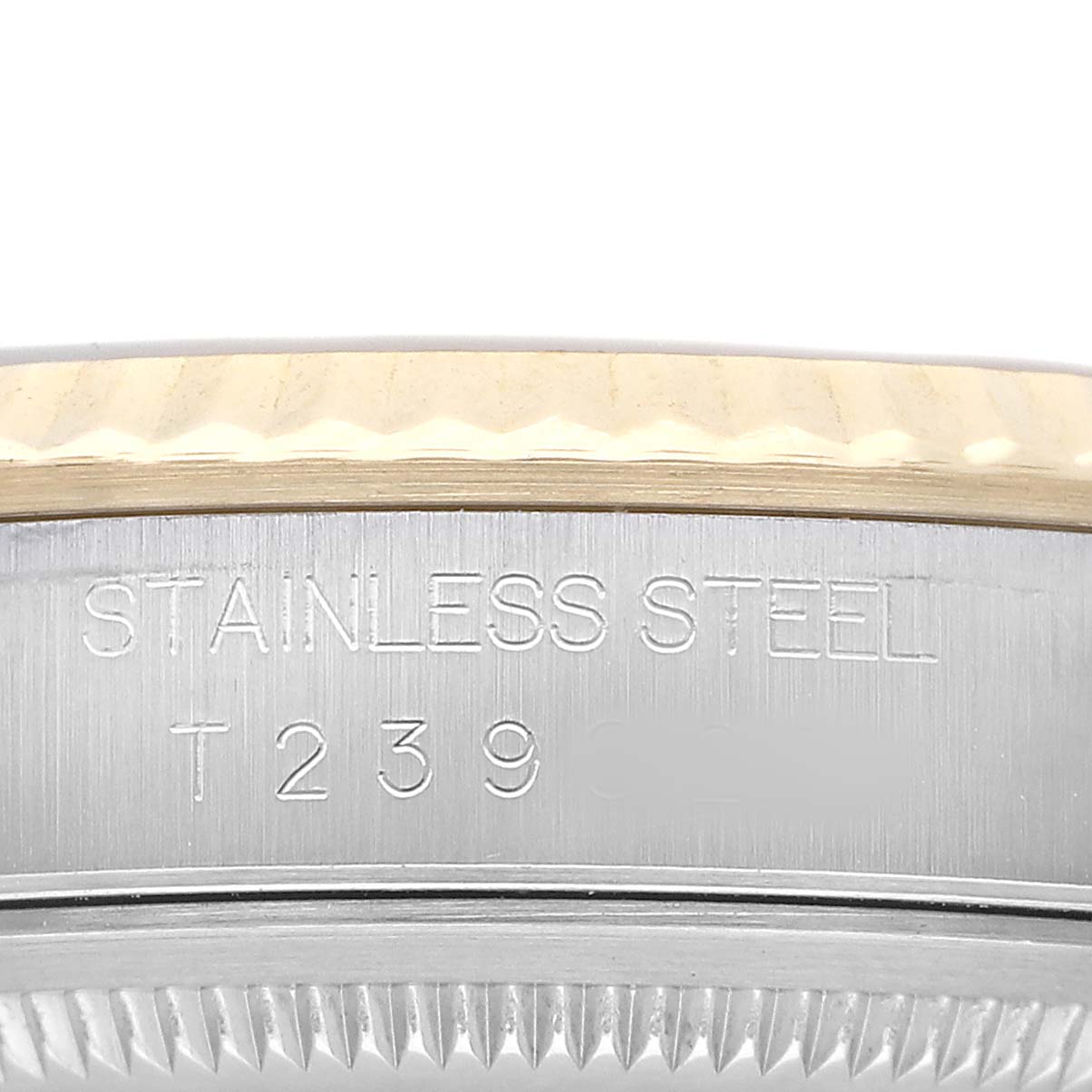 The image shows a close-up of the side of a Rolex Datejust 16233 Men's Steel and Gold (two tone) Champagne Dial, highlighting the case and stainless steel engraving.