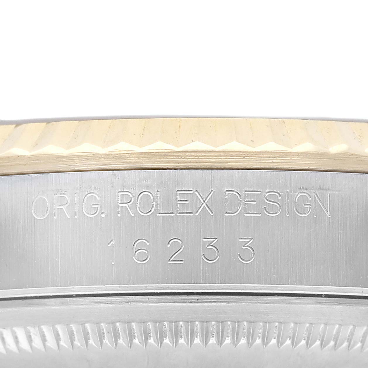 The image shows a close-up of the case side of the Rolex Datejust 16233 Men's Steel and Gold (two tone) Champagne Dial, displaying its model number and "Orig. Rolex Design" engraving.