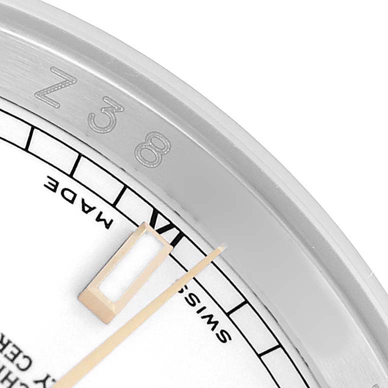 The image shows a close-up of the Rolex Datejust 116233 Men's Steel and Gold (two tone) White Dial dial, highlighting the hour marker and part of the bezel.
