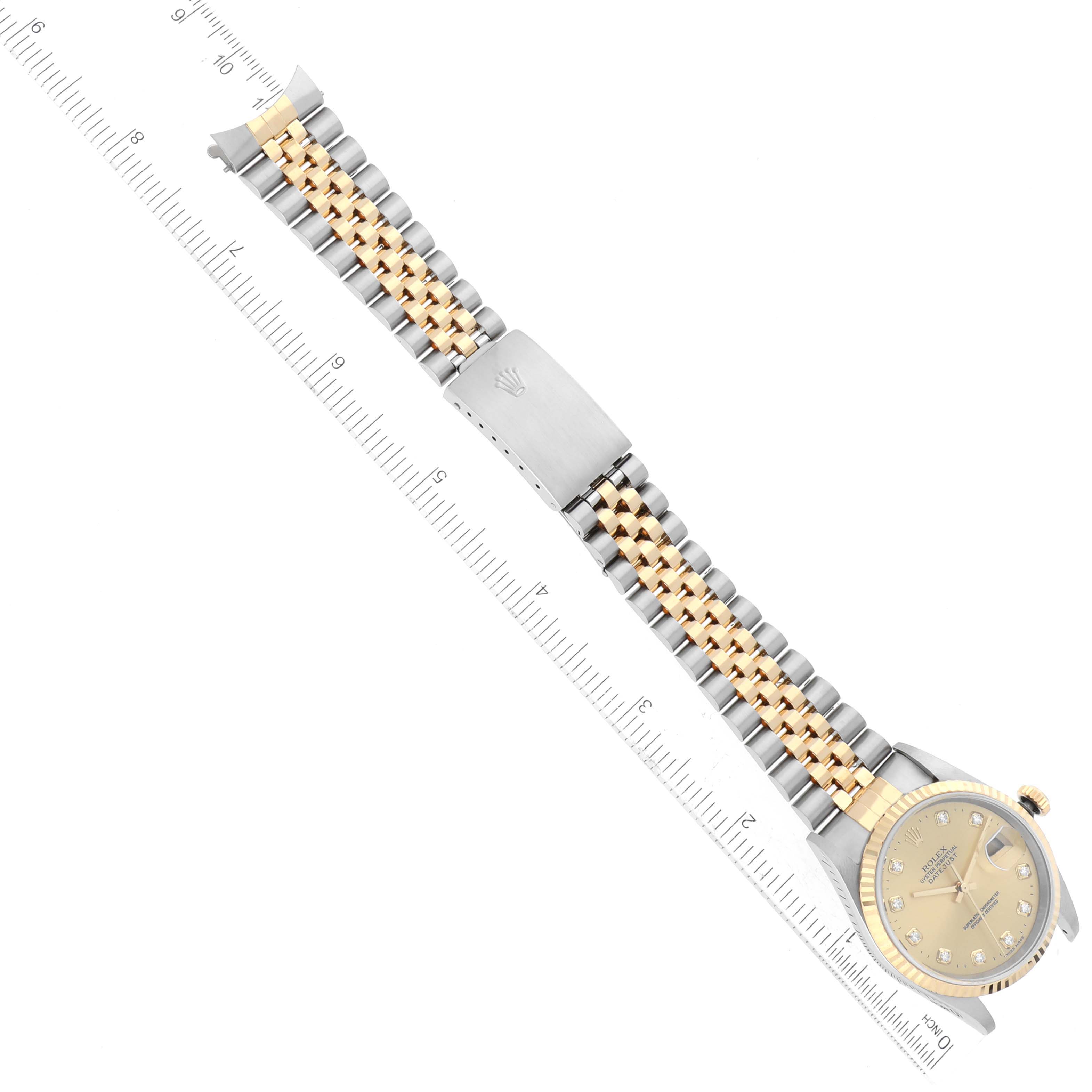 The image shows a Rolex Datejust 16233 Men's Steel and Gold (two tone) Champagne Dial 16233 Men's Steel and Gold (two tone) Champagne Dial model watch laid flat from an overhead angle, displaying its face and two-tone bracelet.