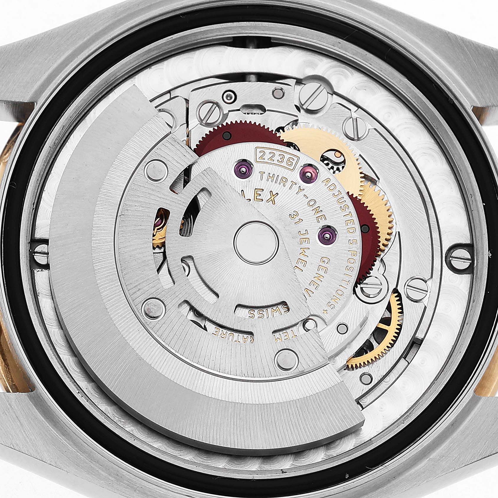 The image shows the movement of a Rolex Mid-Size 278243 Women's Steel and Gold (two tone) Champagne Dial model from the back, highlighting the rotor and internal components.