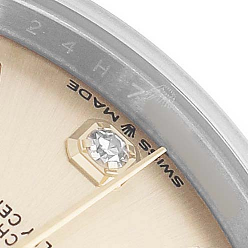 The image shows a close-up of the Rolex Mid-Size 278243 Women's Steel and Gold (two tone) Champagne Dial watch dial, featuring a diamond marker and the words "Swiss Made."