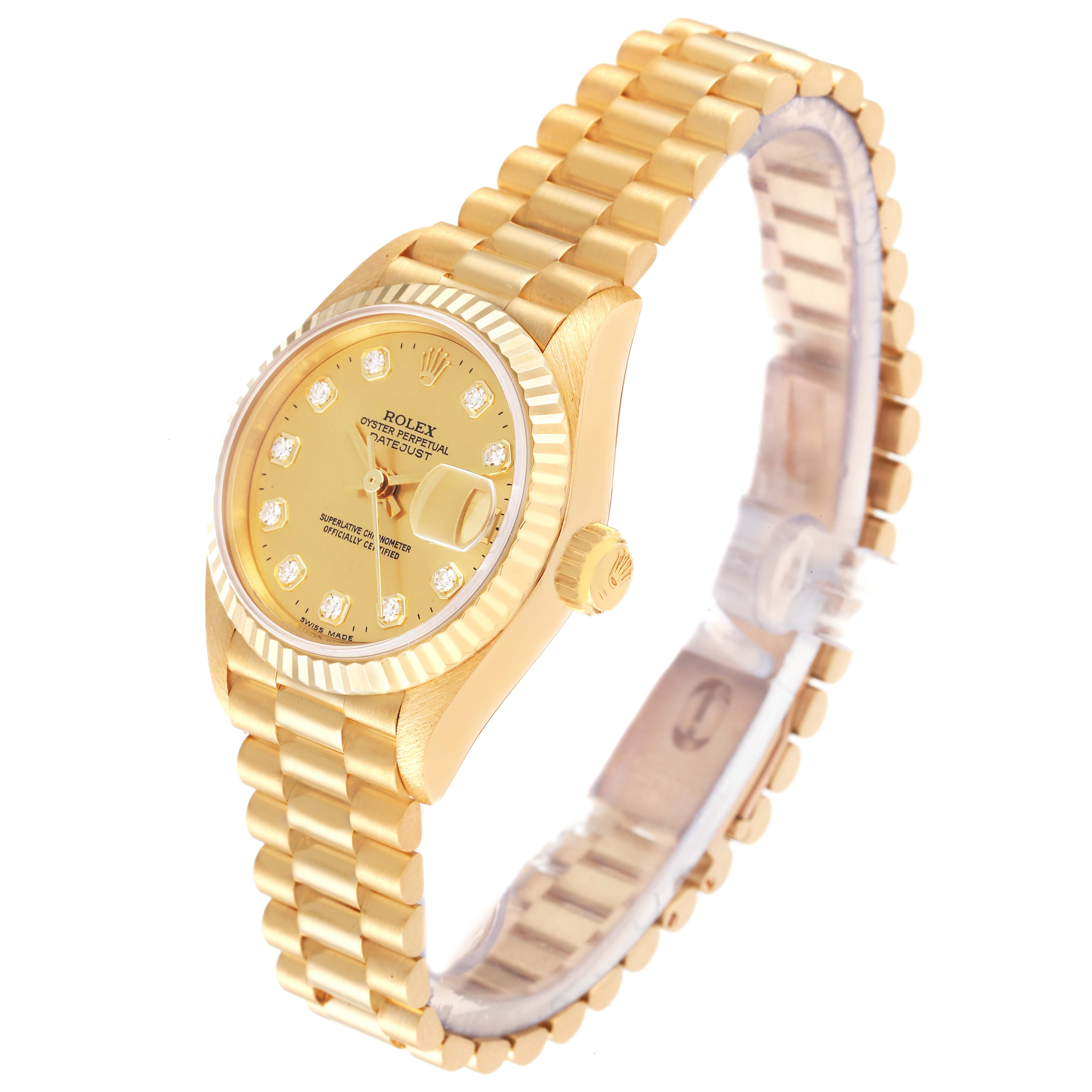 The image shows a Rolex President 69178 Women
s Yellow Gold Champagne Dial 69178 Women
s Yellow Gold Champagne Dial model watch from a three-quarter angle, highlighting its gold case, bracelet, and diamond markers.