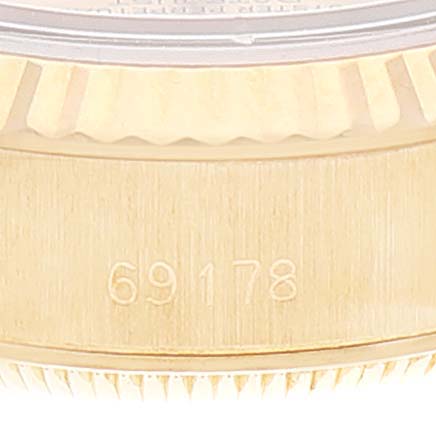 This image shows a side view of the case and the model number "69178" engraved on the bezel of a Rolex President 69178 Women
s Yellow Gold Champagne Dial 69178 Women
s Yellow Gold Champagne Dial watch.