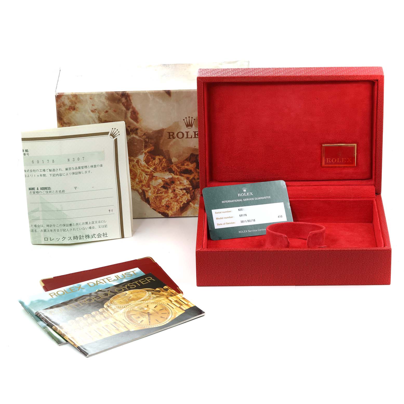 This image shows the packaging, warranty card, and booklets of a Rolex President 69178 Women
s Yellow Gold Champagne Dial 69178 Women
s Yellow Gold Champagne Dial model watch from a frontal view.