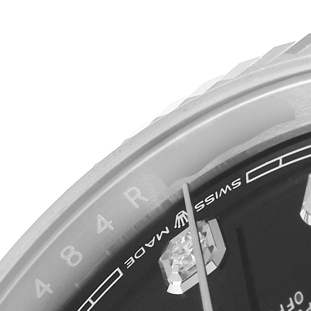 This image shows a close-up angle of the bezel and part of the dial of a Rolex Datejust 126234 Men
s Stainless Steel Black Dial 126234 Men
s Stainless Steel Black Dial watch, focusing on the "Swiss Made" text.