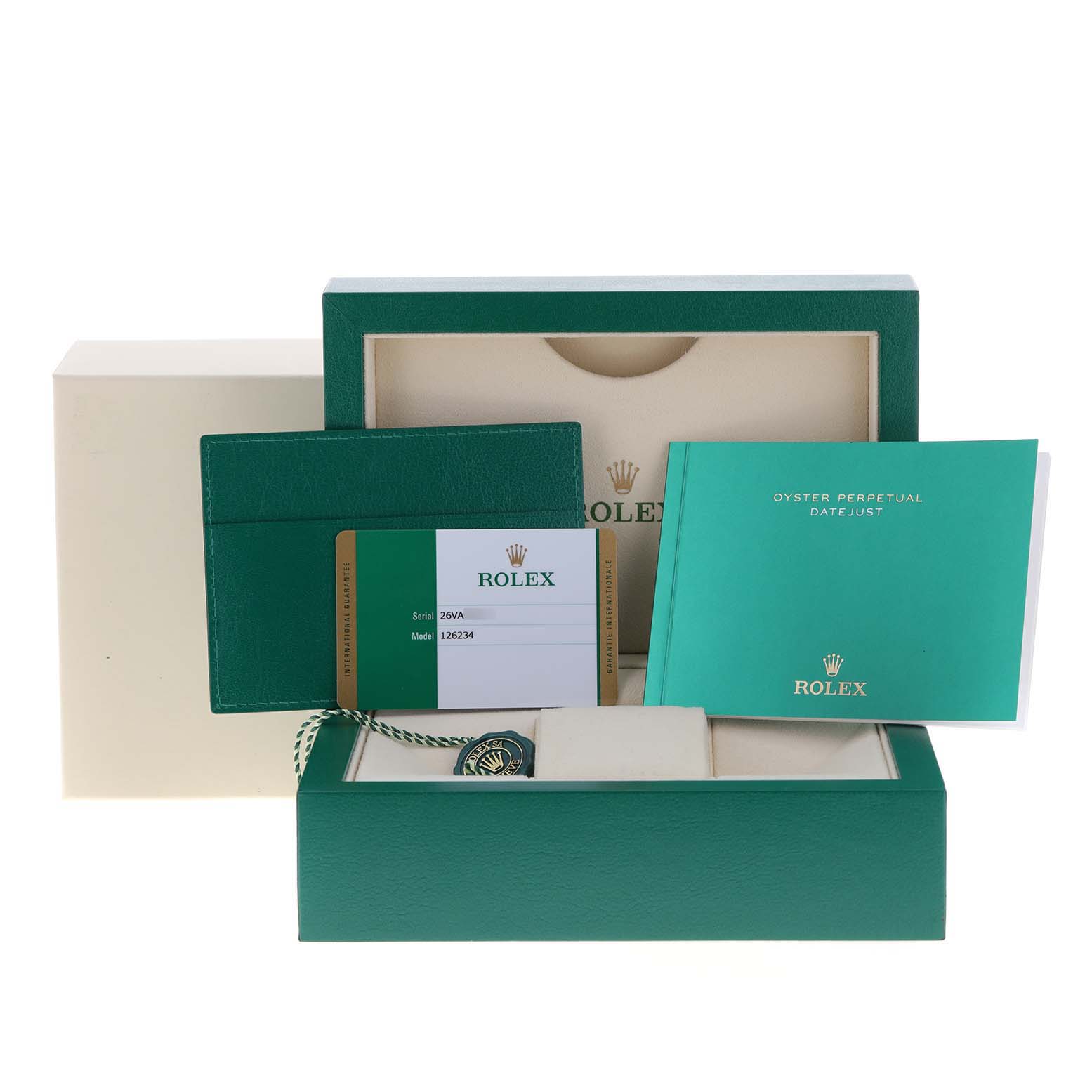 This image shows the packaging and accessories for a Rolex Datejust 126234 Men
s Stainless Steel Black Dial 126234 Men
s Stainless Steel Black Dial watch, including the box, manual, and warranty card.