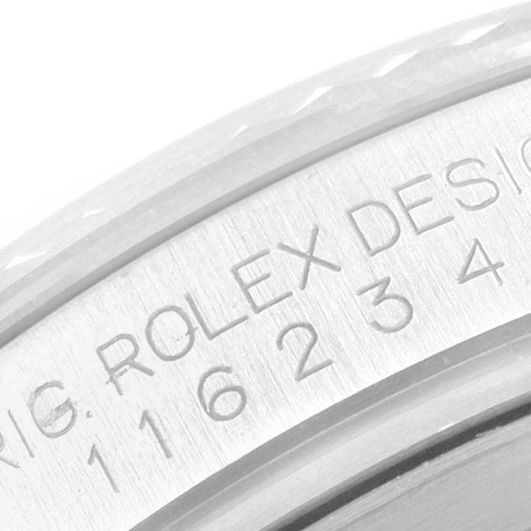 This close-up image shows the engraved serial number and branding inside the bezel of a Rolex Datejust 116234 Men
s Stainless Steel Black Dial 116234 Men
s Stainless Steel Black Dial watch.