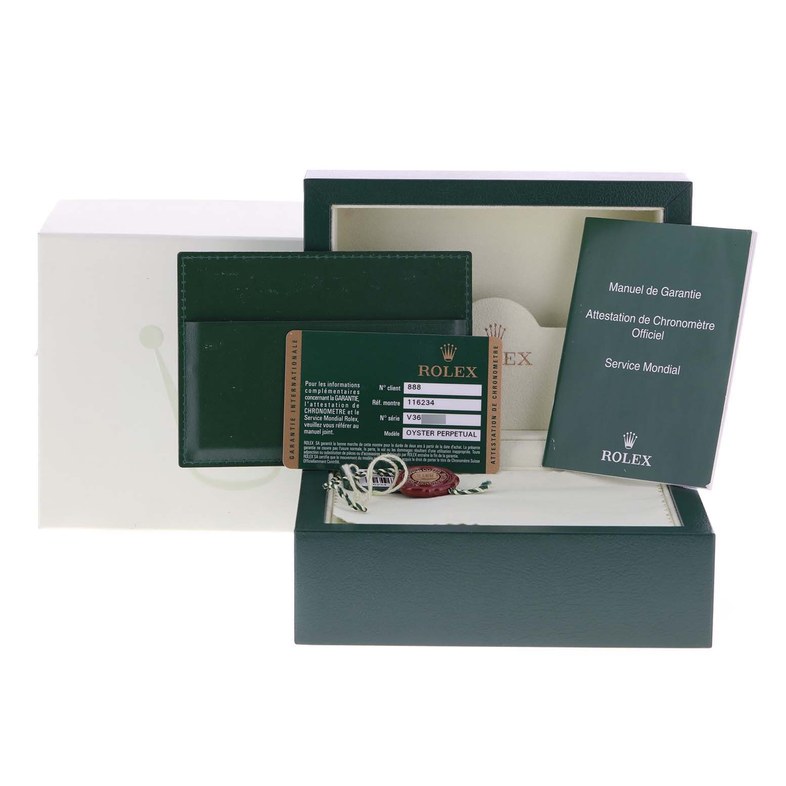 The image shows the box and accessories of a Rolex Datejust 116234 Men
s Stainless Steel Black Dial 116234 Men
s Stainless Steel Black Dial watch, including a warranty card, booklet, and tags, from a front angle.