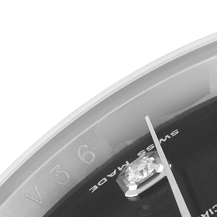 Close-up of the Rolex Datejust 116234 Men
s Stainless Steel Black Dial 116234 Men
s Stainless Steel Black Dial watch
s dial, showcasing a diamond marker at the 6 o
clock position and part of the minute hand.
