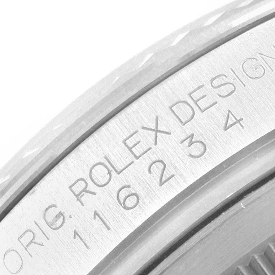 This close-up image shows the engraved bezel and part of the case of a Rolex Datejust 116234 Men
s Stainless Steel Black Dial 116234 Men
s Stainless Steel Black Dial watch.