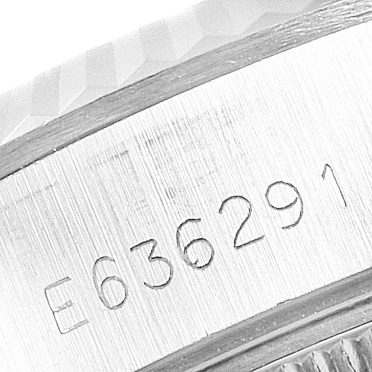 The image shows a close-up of the serial number engraving on the side of a Rolex Datejust 69174 Women's Stainless Steel Silver Dial 69174 Women's Stainless Steel Silver Dial watch's case.